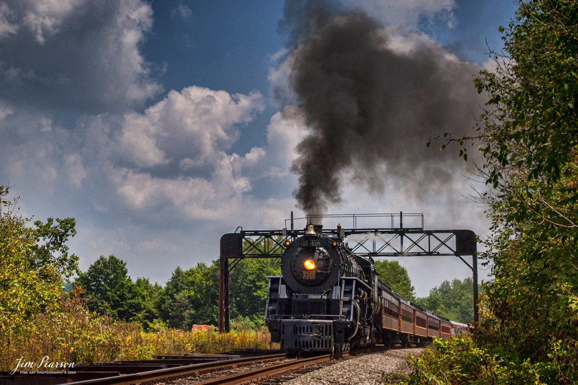 August 1, 2004 - Ohio Central (ex Grand Trunk Western) 4-8-4 #6325 is running at track speed on one of several excursions run in conjunction with the Dennison, Ohio Railfest in 2004. This shot was made on one of the runs north from the Railfest site in Dennison. Ohio Central 6325 and Canadian Pacific 4-6-2 #2613 handled the steam trips during the Railfest weekend.

Tech Info: Nikon D100, Sigma 24-70mm @46mm, f/11, 1/640, ISO 400.

#trainphotography #railroadphotography #jimpearsonphotography #ohiocentral #steamtrain