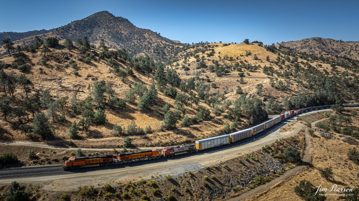 September 18th, 2024, BNSF mixed freight heads north through the mountains toward Tehachapi, California, on the Union Pacific Mojave Subdivision on a beautiful summer evening.

Tech Info: DJI Mavic 3 Classic Drone, RAW, 24mm, f/2.8, 1/1600, ISO 110.

#railroad #railroads #train, #trains #railway #railway #steamtrains #railtransport #railroadengines #picturesoftrains #picturesofrailways #besttrainphotograph #bestphoto #photographyoftrains #bestsoldpicture #JimPearsonPhotography #trainsfromtheair #trainsfromadrone