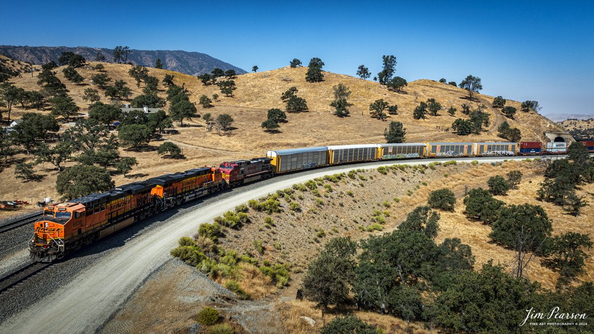 September 19th, 2024, BNSF freight train heads north through the mountains after passing through the Tehachapi the loop at Woodford, California, on the Union Pacific Mojave Subdivision.

Tech Info: DJI Mavic 3 Classic Drone, RAW, 24mm, f/2.8, 1/2000, ISO 100.

#railroad #railroads #train, #trains #railway #railway #steamtrains #railtransport #railroadengines #picturesoftrains #picturesofrailways #besttrainphotograph #bestphoto #photographyoftrains #bestsoldpicture #JimPearsonPhotography #trainsfromtheair #trainsfromadrone