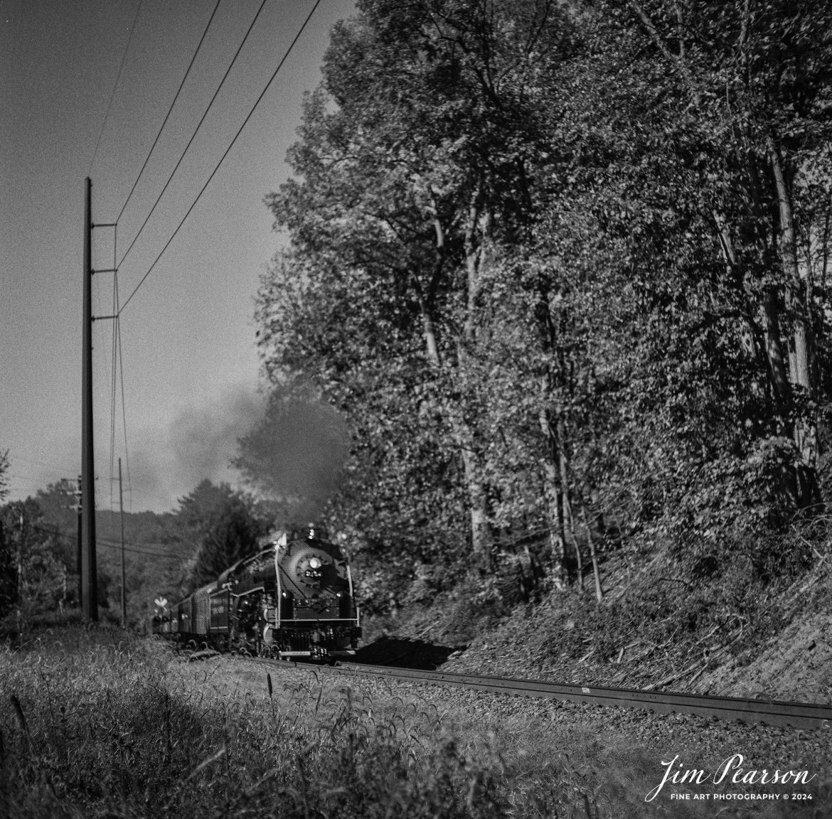 Film Wednesday – October 5th, 2024, Reading Blue Mountain and Northern 2102 makes its way toward Jim Thorpe, PA during their first fall color run of the season.

According to Wikipedia: Reading Blue Mountain and Northern 2102 (historically known as Reading 2102) is a preserved "T-1" 4-8-4 "Northern" type steam locomotive. Originally built by the Baldwin Locomotive Works in March 1925 as an "I-10sa" 2-8-0 "Consolidation" type locomotive for the Reading Company, No. 2102 was rebuilt by the Reading's own locomotive Shops as a 4-8-4 "Northern" in September 1945, and it was used for pulling heavy coal trains for the railroad until being retired from revenue service in 1956.

Between 1962 and 1964, No. 2102 was used to haul the Iron Horse Rambles excursion trains. After the Rambles ended in 1964, No. 2102 was sold to Steam Tours Inc. of Akron, Ohio, and it spend the next several years pulling various fan trips in the Northeast, Mid-Atlantic and Midwest. In 1985, it was sold again to Andy Muller to operate on his Reading Blue Mountain and Northern Railroad alongside 4-6-2 No. 425, until its flue time expired, on October 27, 1991. Beginning in February 2016, the locomotive was restored to operating condition, and then it returned to service, in April 2022.

Tech Info: Mamiya C330 Professional, Ilford HP5 Film, Mamiya 80mm, f/4, 1/500, ISO 400.

#JimPearsonPhotography #filmphotography #blackandwhite #filmphotography