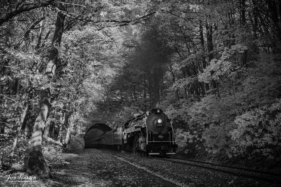 This week’s Saturday Infrared photo is of Reading Blue Mountain & Northern Railroad steam locomotive 2102 as it pulls through the Nesquehoning Tunnel at Nesquehoning, Pennsylvania on October 5th, 2024, during its first day of the year of pulling Fall Foliage Excursions.

According to their website: The Reading Company T-1 class #2102 was built in the Reading’s own locomotive shops in 1945. With drivers of 70” diameter, it weighs 404 tons, and its tender holds up to 26 tons of coal, and up to 19,000 gallons of water. After the Reading Steam era was over, the Reading Company used 2102 for the Reading Rambles on several different excursions. The 2102 has had many different owners since it was retired by the Reading Railroad. It is one of only four to survive. The other remaining locomotives are the 2100, 2101, and 2124.

The Blue Mountain and Reading Railroad purchased the 2102 in 1987, and it ran on the Temple to South Hamburg line into the early 1990’s. Once the Blue Mountain and Reading Railroad became the Reading Blue Mountain & Northern, the 2102 ran over Reading & Northern’s rails for a short time before it was removed from service in the early 1990’s. 

In 2022, steam locomotive 2102 reentered service on the Reading & Northern. The locomotive has been used actively to pull both passenger excursions and revenue freight trains.

Tech Info: Fuji XT-1, RAW, Converted to 720nm B&W IR, Nikon 10-24mm @24mm, f/4.5, 1/500, ISO 800.

#steamtrains #besttrainphotograph #JimPearsonPhotography #RBNRR #infraredphotography