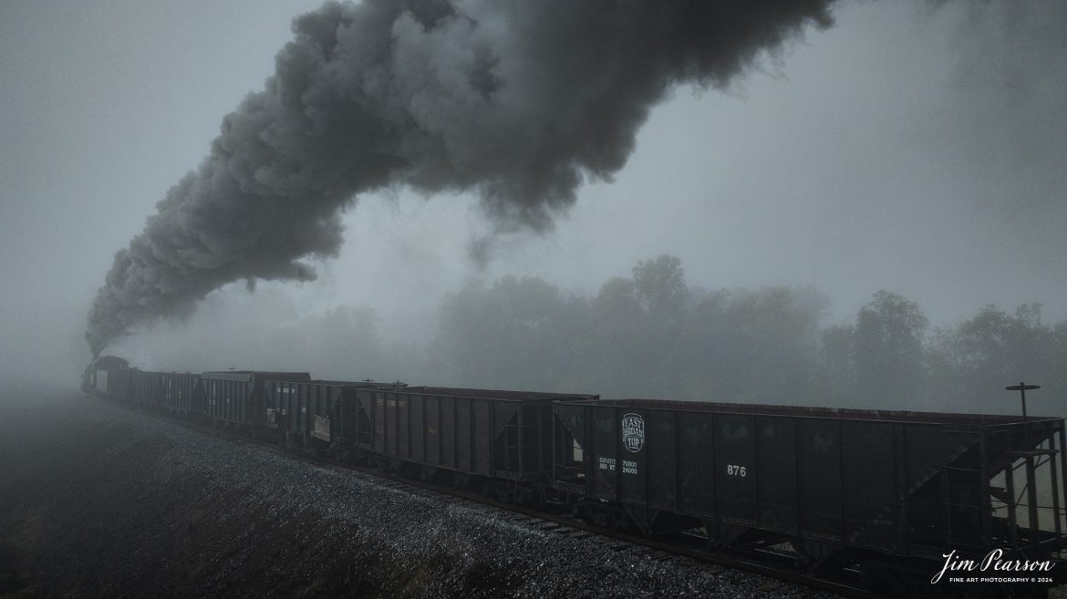 East Broad Top (EBT) steam locomotive #16 pulls a mixed freight through the early morning fog as they head to Rockhill Furnace, Pennsylvania on October 6th, 2024, during the museum’s Friends of the East Broad top event.

According to the East Broad Top Website: Locomotive #16 was built in 1916 by the Baldwin Locomotive Works.

Entering the age of modern steam in 1916, the EBT received its first of three large Mikados. Unlike the previous three smaller locomotives, #16 came with superheaters, piston valves, and Southern valve gear. One story mentions #16 pulled 60 empty hoppers from Mt. Union to Rockhill in one train, literally clearing out the yard. #16 underwent an overhaul in 1955 and made only a handful of trips in early 1956 before the railroad shut down an overhaul when the EBT shut down. On February 1, 2023, the locomotive returned to service.

Tech Info: DJI Mavic 3 Classic Drone, RAW, 24mm, f/2.8, 1/400, ISO 120.

#railroad #railroads #train, #trains #railway #railway #steamtrains #railtransport #railroadengines #picturesoftrains #picturesofrailways #besttrainphotograph #bestphoto #photographyoftrains #bestsoldpicture #JimPearsonPhotography #trainsfromtheair #trainsfromadrone #eastbroadtop