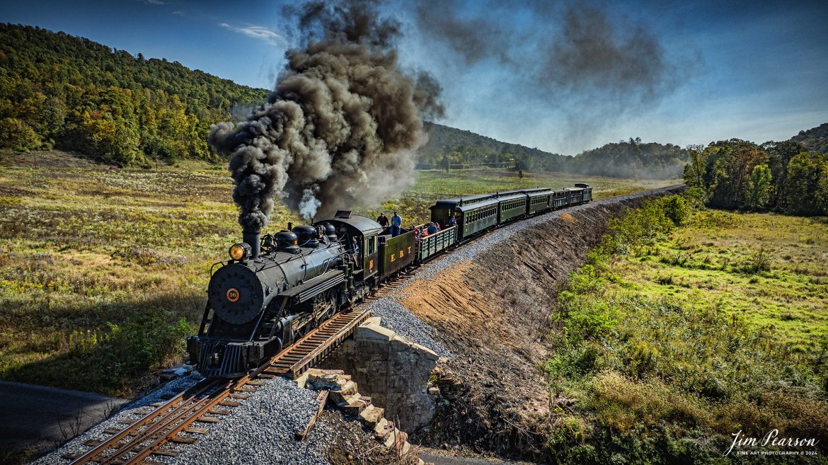 East Broad Top (EBT) steam locomotive #16 pulls a passenger train out of Rockhill Furnace, Pennsylvania on October 6th, 2024, on a beautiful fall afternoon.

According to the East Broad Top Website: Locomotive #16 was built in 1916 by the Baldwin Locomotive Works.

Entering the age of modern steam in 1916, the EBT received its first of three large Mikados. Unlike the previous three smaller locomotives, #16 came with superheaters, piston valves, and Southern valve gear. One story mentions #16 pulled 60 empty hoppers from Mt. Union to Rockhill in one train, literally clearing out the yard. #16 underwent an overhaul in 1955 and made only a handful of trips in early 1956 before the railroad shut down an overhaul when the EBT shut down. On February 1, 2023, the locomotive returned to service.

Tech Info: DJI Mavic 3 Classic Drone, RAW, 24mm, f/2.8, 1/4000, ISO 300.

#steamtrains #JimPearsonPhotography #trainsfromtheair #EastBroadTop