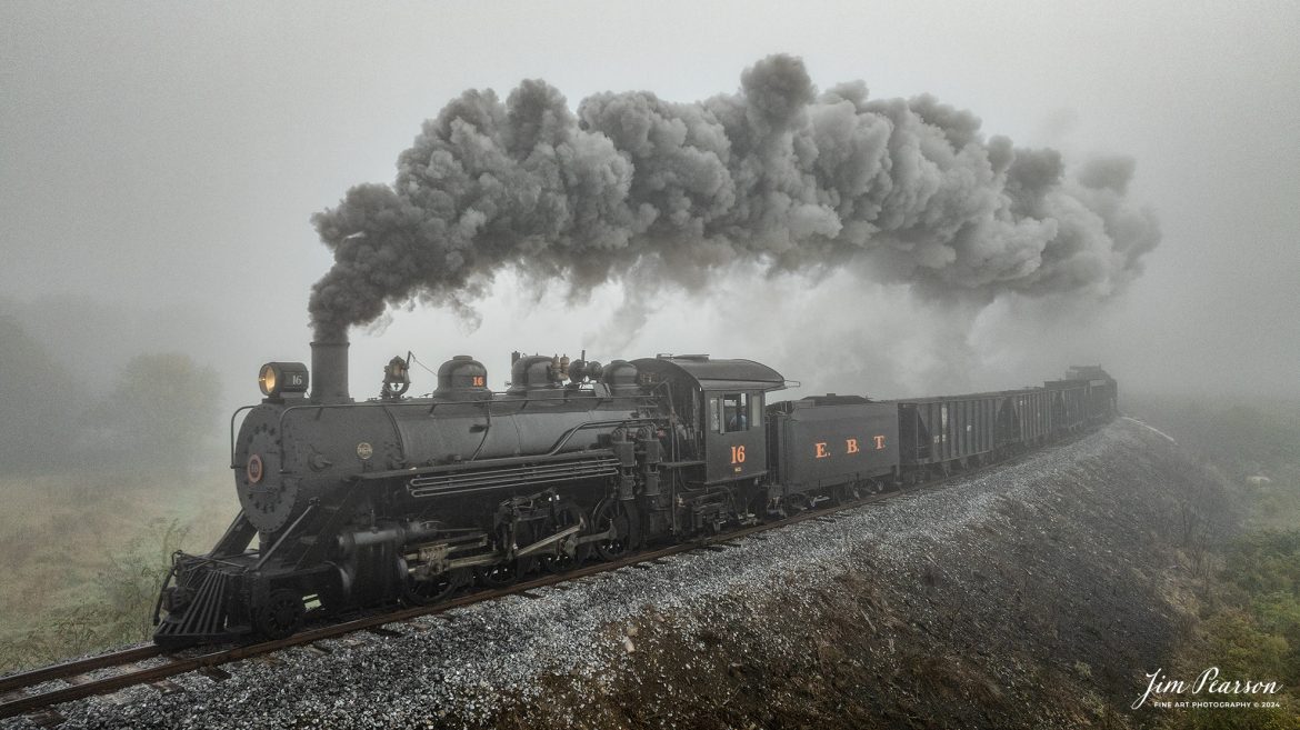 East Broad Top (EBT) steam locomotive #16 pulls a mixed freight through the early morning fog as they head to Rockhill Furnace, Pennsylvania on October 5th, 2024, during the museum’s Friends of the East Broad top event.

This is my first post from a week-long trip I took with Bryan Burton (Photography) where we traveled 2,800 miles and covered steam operations at Reading and Blue Northern Railway (2102), East Broad Top Railroad, Strasburg Railroad and then a two-day photo charter by Dak Dillion Photography at the Valley Railroad in Essex, CT. It was a long, but fun and exciting trip for sure! You’ll see a lot of steam action over the coming weeks!

According to the East Broad Top Website: Locomotive #16 was built in 1916 by the Baldwin Locomotive Works.

Entering the age of modern steam in 1916, the EBT received its first of three large Mikados. Unlike the previous three smaller locomotives, #16 came with superheaters, piston valves, and Southern valve gear. One story mentions #16 pulled 60 empty hoppers from Mt. Union to Rockhill in one train, literally clearing out the yard. #16 underwent an overhaul in 1955 and made only a handful of trips in early 1956 before the railroad shut down an overhaul when the EBT shut down. On February 1, 2023, the locomotive returned to service.

Tech Info: DJI Mavic 3 Classic Drone, RAW, 24mm, f/2.8, 1/400, ISO 100.

#railroad #railroads #train, #trains #railway #railway #steamtrains #railtransport #railroadengines #picturesoftrains #picturesofrailways #besttrainphotograph #bestphoto #photographyoftrains #bestsoldpicture #JimPearsonPhotography #trainsfromtheair #trainsfromadrone #EastBroadTop