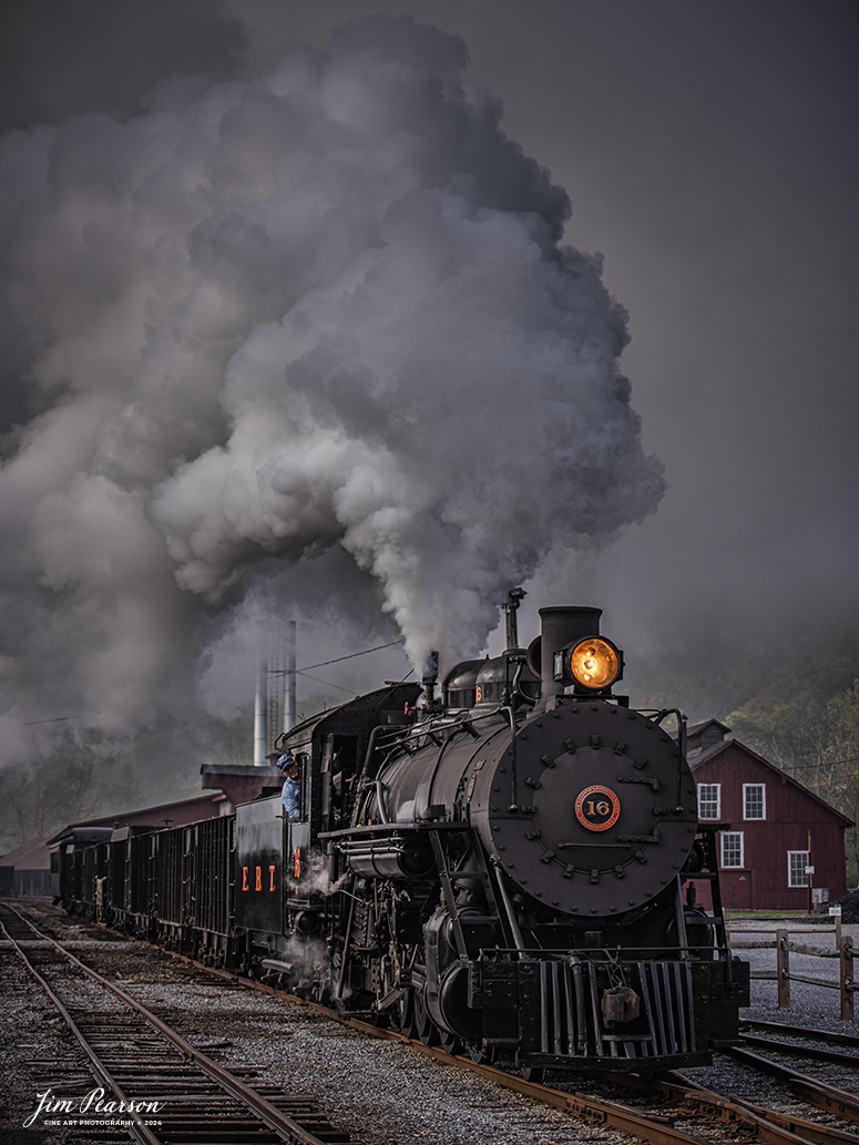 East Broad Top (EBT) steam locomotive #16 pulls a mixed freight through the early morning fog as they head out of the yard at Rockhill Furnace, Pennsylvania on October 6th, 2024, during the museum’s Friends of the East Broad top event.

According to the East Broad Top Website: Locomotive #16 was built in 1916 by the Baldwin Locomotive Works.

Entering the age of modern steam in 1916, the EBT received its first of three large Mikados. Unlike the previous three smaller locomotives, #16 came with superheaters, piston valves, and Southern valve gear. One story mentions #16 pulled 60 empty hoppers from Mt. Union to Rockhill in one train, literally clearing out the yard. #16 underwent an overhaul in 1955 and made only a handful of trips in early 1956 before the railroad shut down an overhaul when the EBT shut down. On February 1, 2023, the locomotive returned to service.

Tech Info: Nikon D810, RAW, Nikon 70-300 @70mm, f/4.5, 1/400, ISO 64.

steam locomotive, train, railways, vintage, smoke, green hillside, sunlight, iron bridge, transportation, travel, photography of trains, train photography, Jim Pearson Photography, trending photo, East Broad Top Railroad, steam train