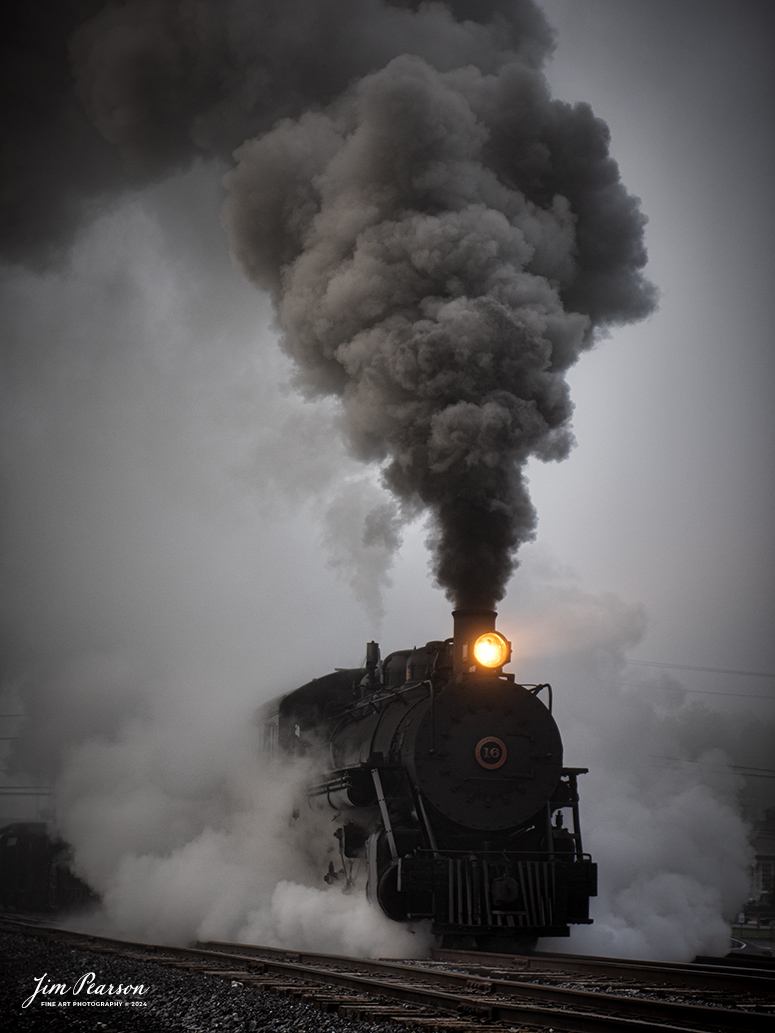 East Broad Top (EBT) steam locomotive #16 pulls a mixed freight through the early morning fog as they head out of the yard at Rockhill Furnace, Pennsylvania on October 6th, 2024, during the museum’s Friends of the East Broad top event.

According to the East Broad Top Website: Locomotive #16 was built in 1916 by the Baldwin Locomotive Works.

Entering the age of modern steam in 1916, the EBT received its first of three large Mikados. Unlike the previous three smaller locomotives, #16 came with superheaters, piston valves, and Southern valve gear. One story mentions #16 pulled 60 empty hoppers from Mt. Union to Rockhill in one train, literally clearing out the yard. #16 underwent an overhaul in 1955 and made only a handful of trips in early 1956 before the railroad shut down. On February 1, 2023, the locomotive returned to service.

Tech Info: Nikon D810, RAW, Nikon 70-300 @70mm, f/4.5, 1/400, ISO 64.

steam locomotive, train, railways, vintage, smoke, green hillside, sunlight, iron bridge, transportation, travel, photography of trains, train photography, Jim Pearson Photography, trending photo, East Broad Top Railroad, steam train