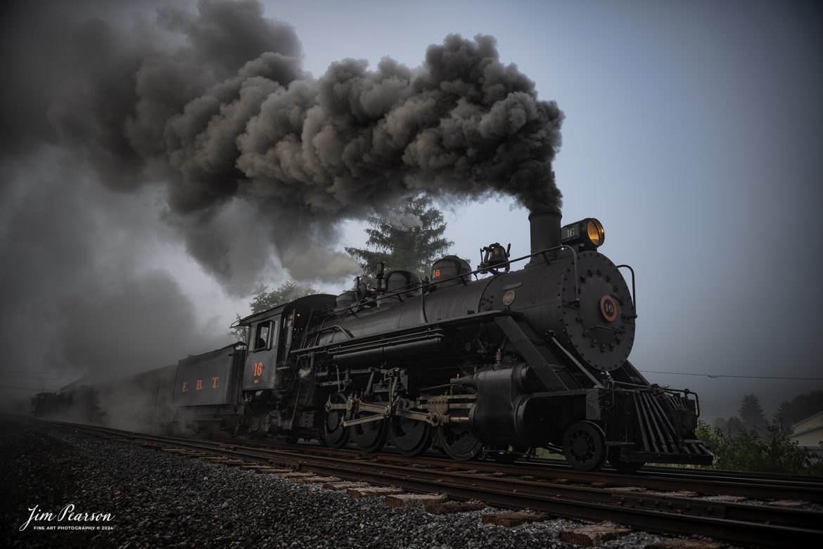 East Broad Top (EBT) steam locomotive #16 pulls a mixed freight through the early morning fog as they head out of Rockhill Furnace, Pennsylvania on October 5th, 2024, during the museum’s Friends of the East Broad top event.

According to the East Broad Top Website: Locomotive #16 was built in 1916 by the Baldwin Locomotive Works.

Entering the age of modern steam in 1916, the EBT received its first of three large Mikados. Unlike the previous three smaller locomotives, #16 came with superheaters, piston valves, and Southern valve gear. One story mentions #16 pulled 60 empty hoppers from Mt. Union to Rockhill in one train, literally clearing out the yard. #16 underwent an overhaul in 1955 and made only a handful of trips in early 1956 before the railroad shut down an overhaul when the EBT shut down. On February 1, 2023, the locomotive returned to service.

Tech Info: DJI Mavic 3 Classic Drone, RAW, 24mm, f/2.8, 1/400, ISO 80.

#railroad #railroads #train, #trains #railway #railway #steamtrains #railtransport #railroadengines #picturesoftrains #picturesofrailways #besttrainphotograph #bestphoto #photographyoftrains #bestsoldpicture #JimPearsonPhotography #trainsfromtheair #trainsfromadrone #EastBroadTop