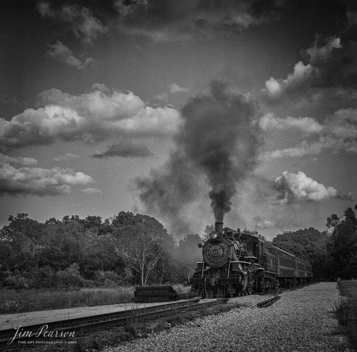 Film Wednesday – October 9th, 2024, The Valley Railroad Company steam engine #97 heads out of Essex, Connecticut with three passenger coaches, during a Dak Dillon Photography photo charter.

According to Wikipedia: The Valley Railroad, operating under the name Essex Steam Train and Riverboat, is a heritage railroad based in Connecticut on tracks of the Connecticut Valley Railroad, which was founded in 1868. The company began operations in 1971 between Deep River and Essex and has since reopened additional parts of the former Connecticut Valley Railroad line. It operates the Essex Steam Train and the Essex Clipper Dinner Train.

Valley Railroad No. 97 is a preserved 2-8-0 steam locomotive that was built in 1923 by the American Locomotive Company's Cooke Works.

Tech Info: Mamiya C330 Professional, Ilford HP5 Film, Mamiya 80mm, f/5.6, 1/400, ISO 400.

#JimPearsonPhotography #filmphotography #blackandwhite #filmphotography