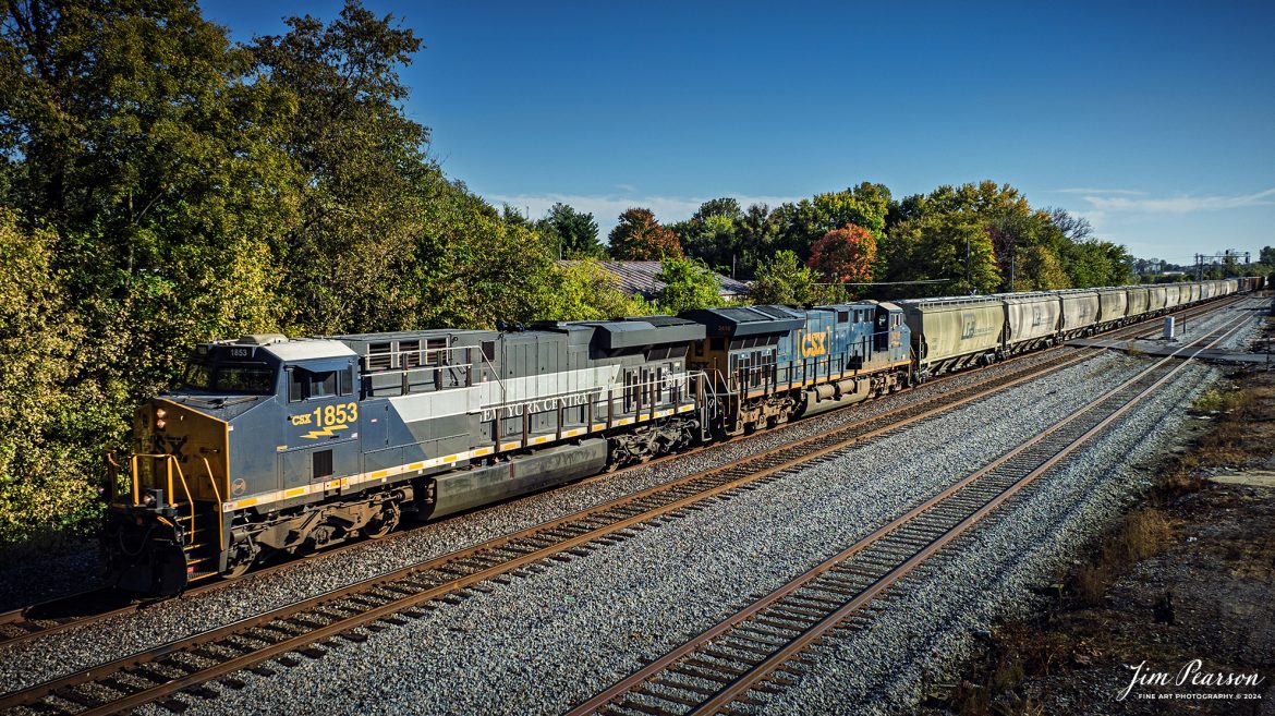 CSX M498, with the New York Central heritage 1877 unit leading, heads north on the CSX Henderson Subdivision, at Henderson, Kentucky, on October 19th, 2024. 

According to the CSX Website: January 3, 2024 - A CSX locomotive commemorating the New York Central Railroad has become the eighth unit in CSX’s heritage locomotive fleet.

Designated CSX 1853 in recognition of the year the NYC was founded, the newest heritage unit was repainted in a special design combining the current CSX colors with the traditional gray and white of the NYC system. The NYC heritage unit has been placed into regular revenue service, proudly carrying the NYC colors across the CSX network.

All of the heritage unit paint schemes have been created at the CSX Waycross Locomotive Shop, where employees performed the challenging work of applying the unique designs. Click below to watch a video of CSX 1853 rolling out of the Waycross shop and hear employees describe the 22-day effort to repaint the unit. 

At its height, the New York Central system encompassed more than 11,000 track miles and provided vital transportation service between New England and the Midwest. It merged with the Pennsylvania Railroad to become the Penn Central in 1968 and later became part of Conrail.

A majority of former NYC lines were acquired by CSX in 1998, and today CSX employees continue to operate trains across the primary NYC routes that have been carrying freight and supporting the U.S. economy for more than a century.

Tech Info: DJI Mavic 3 Classic Drone, RAW, 24mm, f/2.8, 1/2000, ISO 110.

#picturesofrailways #besttrainphotograph #bestphoto #photographyoftrains #bestsoldpicture #JimPearsonPhotography