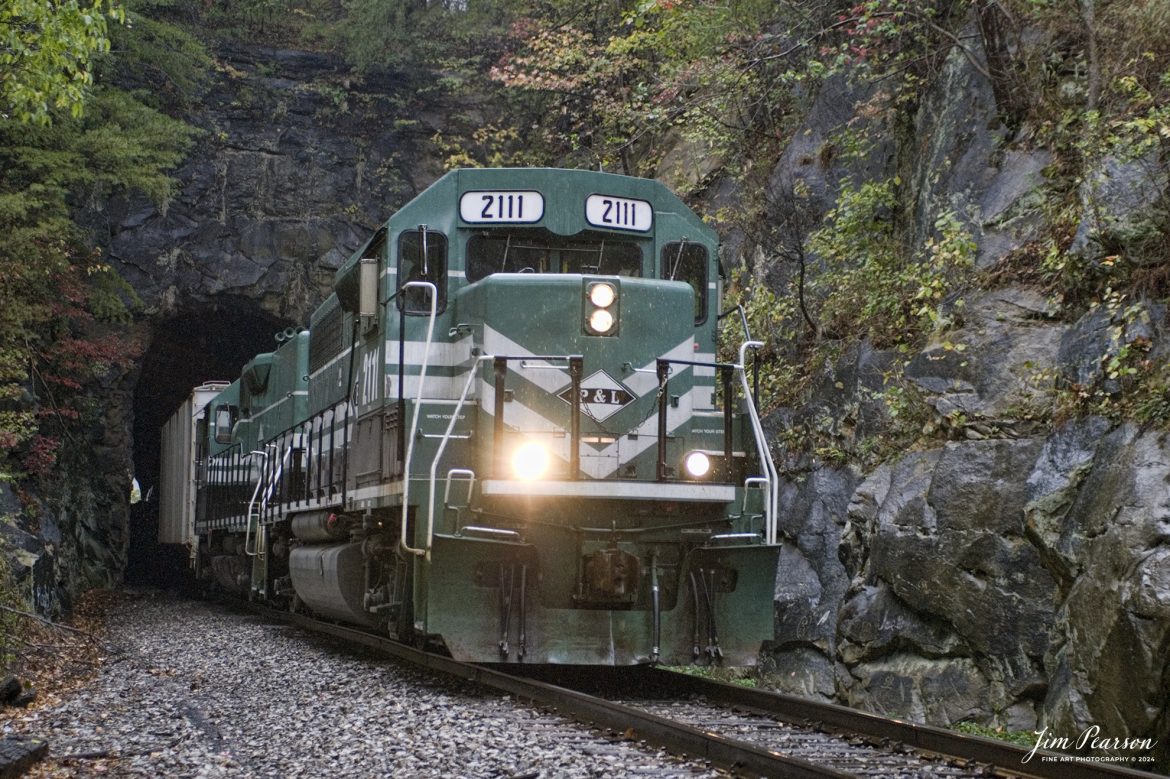 October 22, 2007 – Paducah and Louisville Railway 2111 leads the way as it exits the tunnel at Dawson Springs, Ky as it makes its way south. 

According to Wikipedia: The Paducah & Louisville Railway (reporting mark PAL) is a Class II railroad that operates freight service between Paducah and Louisville, Kentucky. The line is located entirely within the Commonwealth of Kentucky. The 270-mile (430 km) line was purchased from Illinois Central Gulf Railroad in August, 1986.

Tech Info: Nikon D200, RAW, Sigma 24-70 @ 48mm, f2.8, 1/500, ISO 400.

#railroad #railroads #train, #trains #railway #railway #steamtrains #railtransport #railroadengines #picturesoftrains #picturesofrailways #besttrainphotograph #bestphoto #photographyoftrains #bestsoldpicture #JimPearsonPhotography