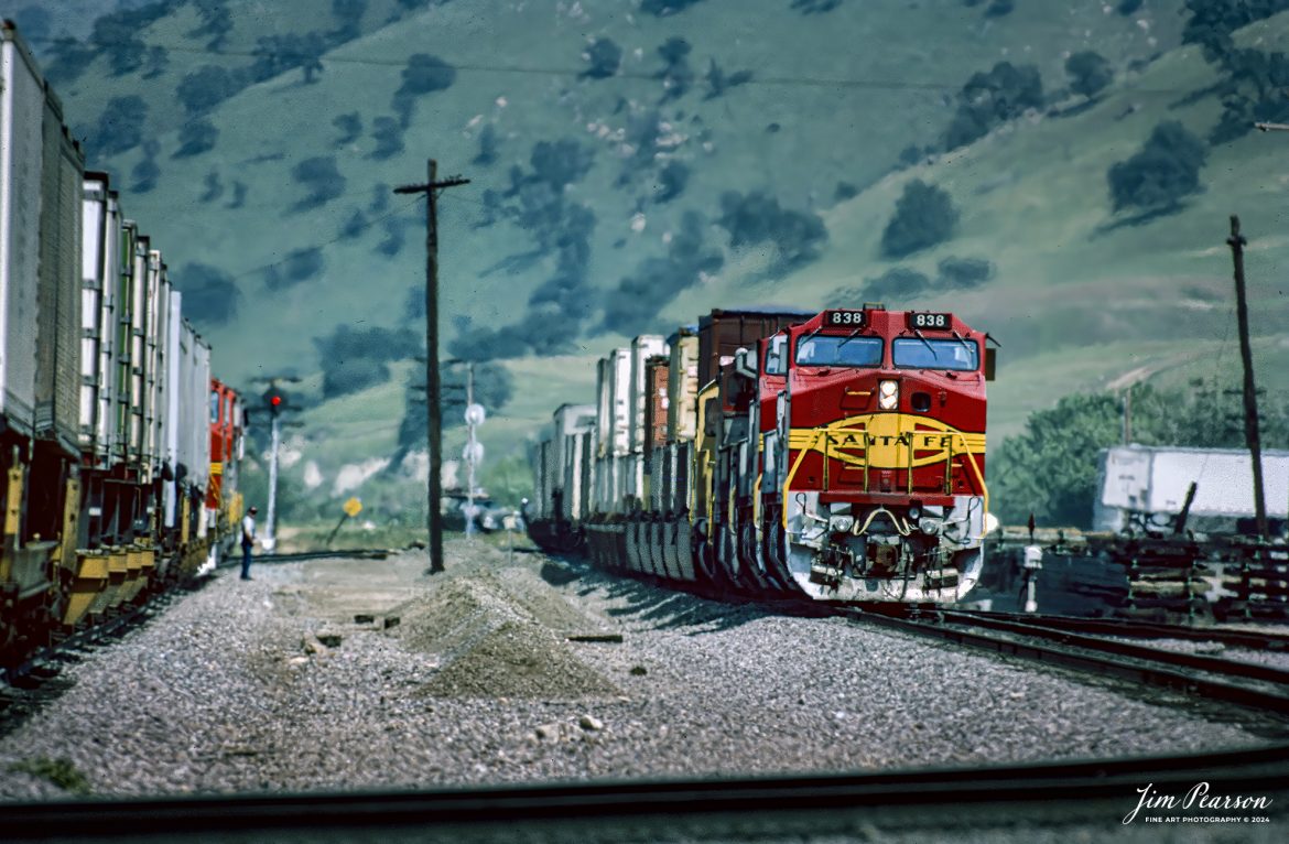 April, 1995 – Blast From The Past – It was a hot, dry day as a Piggyback with SF 838 leading met a northbound, piggyback at Caliente, California, as they make their way through the Tehachapi Mountains on the UP Mojave Subdivision toward Bakersfield, CA, while the conductor on the waiting train does a roll-by inspection.

Thinking of visiting this area? Check out this page on the web!
http://www.trainweb.org/brettrw/maps/caliente.htm

Tech Info: Nikon D200, Nikon 70-300 @300mm, Ektachrome Slide Film, 1/1250, f/5.6, ISO 100.