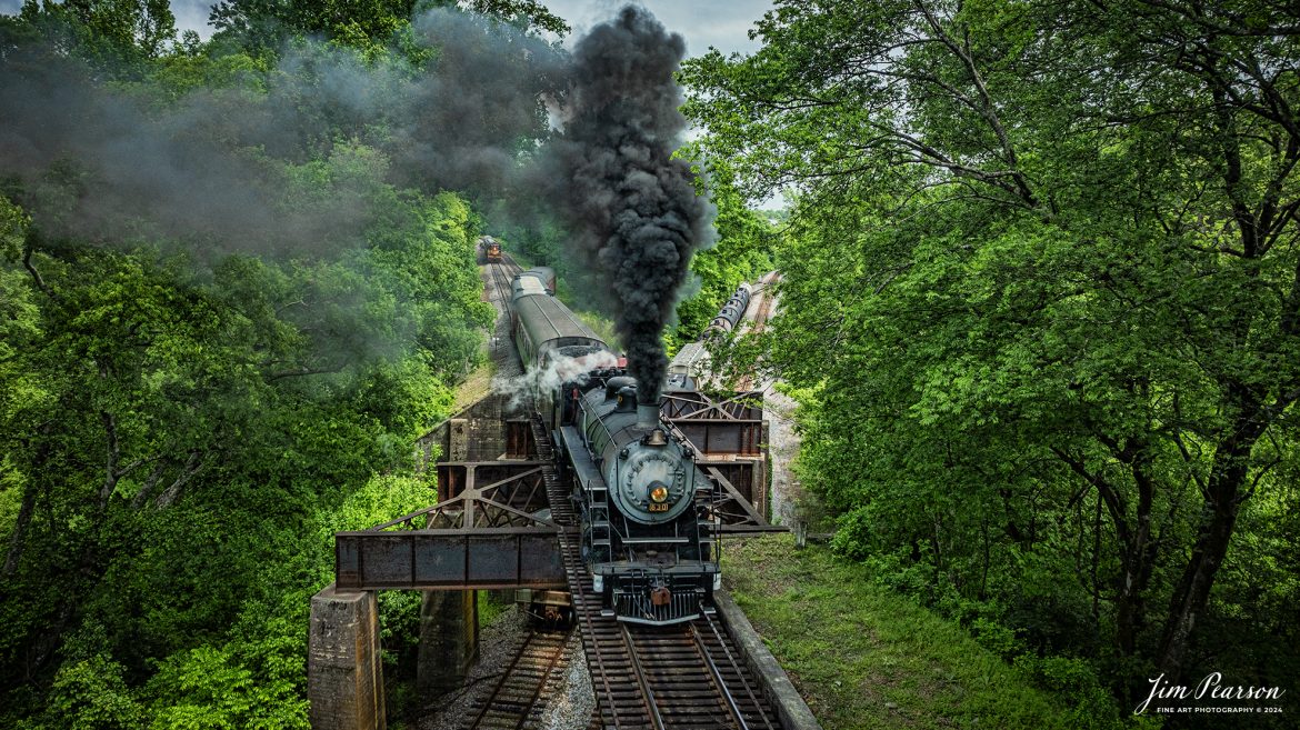 Pulling out of a siding Tennessee Valley Railroad Museum’s steam locomotive Southern Railway 630 crosses over the CSX W&A Subdivision as it heads to East Chattanooga, Tennessee with a trainload of passengers, on April 27th, 2024. 

According to Wikipedia: Southern Railway 630 is a 2-8-0 "Consolidation" type steam locomotive built in February 1904 by the American Locomotive Company (ALCO) of Richmond, Virginia for the Southern Railway as a member of the Ks-1 class. It is currently owned and operated by the Tennessee Valley Railroad Museum in Chattanooga, Tennessee where it resides today for use on excursion trains.

The Tennessee Valley Railroad Museum was founded as a chapter of the National Railway Historical Society in 1960 by Paul H. Merriman and Robert M. Soule, Jr., along with a group of local railway preservationists. They wanted to save steam locomotives and railway equipment for future historical display and use. Today, the museum offers various tourist excursions from stations in Chattanooga and Etowah, Tennessee.

Tech Info: DJI Mavic 3 Classic Drone, RAW, 24mm, f/2.8, 1/1600, ISO 270.

#trainphotography #railroadphotography #trains #railways #trainphotographer #railroadphotographer #jimpearsonphotography #PassengerTrain #TennesseeValleyRailroadMuseum #TennesseeTrains #steamtrain #tvrm