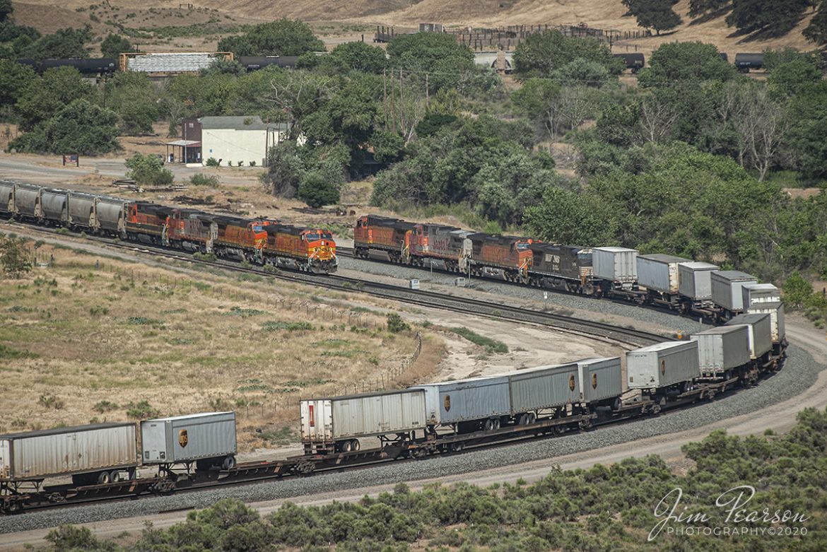 June 23, 2006 - Blast From The Past - It was a hot, dry day as a Piggyback with BNSF 5232 leading headed east, meeting a Mixed freight headed up by BNSF 4438 waiting to head west toward Bakersfield, in horseshoe curve in the valley at Caliente, California as they made their way through the Tehachapi Mountains on the UP Mojave Subdivision.

Thinking of visiting this area? Check out this page on the web!
http://www.trainweb.org/brettrw/maps/caliente.htm

Tech Info: Nikon D200, Nikon 70-300 @200mm, RAW, 1/1250, f/5.6, ISO 100.