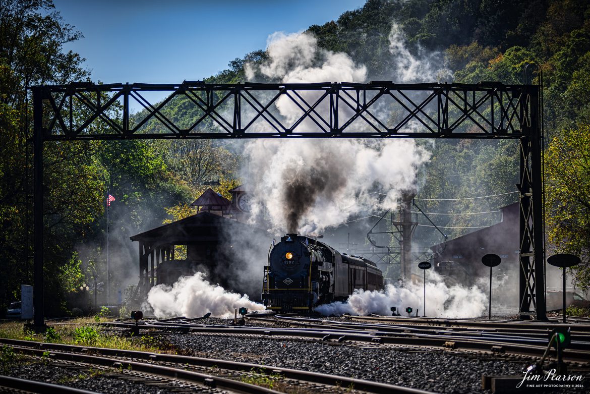 Reading Blue Mountain & Northern Railroad steam locomotive 2102 pulls away from the station at at Port Clinton, Pennsylvania on October 5th, 2024,during its first day of the year of pulling Fall Foliage Excursions.

According to their website: The Reading Company T-1 class #2102 was built in the Reading’s own locomotive shops in 1945. With drivers of 70” diameter, it weighs 404 tons, and its tender holds up to 26 tons of coal, and up to 19,000 gallons of water. After the Reading Steam era was over, the Reading Company used 2102 for the Reading Rambles on several different excursions. The 2102 has had many different owners since it was retired by the Reading Railroad. It is one of only four to survive. The other remaining locomotives are the 2100, 2101, and 2124.

The Blue Mountain and Reading Railroad purchased the 2102 in 1987, and it ran on the Temple to South Hamburg line into the early 1990’s. Once the Blue Mountain and Reading Railroad became the Reading Blue Mountain & Northern, the 2102 ran over Reading & Northern’s rails for a short time before it was removed from service in the early 1990’s. 

In 2022, steam locomotive 2102 reentered service on the Reading & Northern. The locomotive has been used actively to pull both passenger excursions and revenue freight trains.

Tech Info: Nikon D810, RAW, Nikon 70-300 @ 135mm, f/5, 1640, ISO 80.

#steamtrains #besttrainphotograph #JimPearsonPhotography #RBNRR