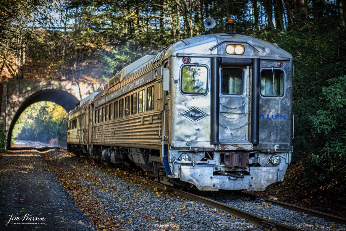 Reading & Northern's RDC "Buddliner" #9168 (RDC-1) their two car train towards Jim Thorpe, Pennsylvania, after passing through Nesquehoning Tunnel on October 5th, 2024.

According to their website: The Reading and Northern Railroad owns and operates three self-propelled Rail Diesel Cars #9166,  #9167, and #9168. The cars were built by the former Budd Company of Philadelphia in the 1950's for commuter use by various railroads. All of our RDCs have functional windows and clean restrooms, and are fully climate controlled. 

The #9167 & #9168 are full coaches offering comfortable padded seats that flip to face whichever direction the train is traveling.

The #9166 is a half coach. The other half of the car features a snack counter and seating area where snacks and light refreshments could be served.

Tech Info: Nikon D810, RAW, Nikon 24-70 @ 70mm,  1/320, f/2.8, ISO 720.

#steamtrains #besttrainphotograph #JimPearsonPhotography #RBNRR