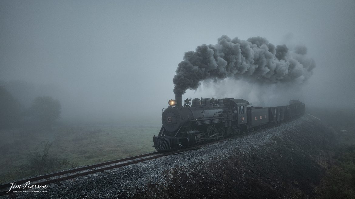 East Broad Top (EBT) steam locomotive #16 pulls a mixed freight through the early morning fog as they head to Rockhill Furnace, Pennsylvania on October 5th, 2024, during the museum’s Friends of the East Broad top event.

This is my first post from a week-long trip I took with Bryan Burton (Photography) where we traveled 2,800 miles and covered steam operations at Reading and Blue Northern Railway (2102), East Broad Top Railroad, Strasburg Railroad and then a two-day photo charter by Dak Dillion Photography at the Valley Railroad in Essex, CT. It was a long, but fun and exciting trip for sure! You’ll see a lot of steam action over the coming weeks!

According to the East Broad Top Website: Locomotive #16 was built in 1916 by the Baldwin Locomotive Works.

Entering the age of modern steam in 1916, the EBT received its first of three large Mikados. Unlike the previous three smaller locomotives, #16 came with superheaters, piston valves, and Southern valve gear. One story mentions #16 pulled 60 empty hoppers from Mt. Union to Rockhill in one train, literally clearing out the yard. #16 underwent an overhaul in 1955 and made only a handful of trips in early 1956 before the railroad shut down an overhaul when the EBT shut down. On February 1, 2023, the locomotive returned to service.

Tech Info: DJI Mavic 3 Classic Drone, RAW, 24mm, f/2.8, 1/400, ISO 100.

#railroad #railroads #train, #trains #railway #railway #steamtrains #railtransport #railroadengines #picturesoftrains #picturesofrailways #besttrainphotograph #bestphoto #photographyoftrains #bestsoldpicture #JimPearsonPhotography #trainsfromtheair #trainsfromadrone #EastBroadTop