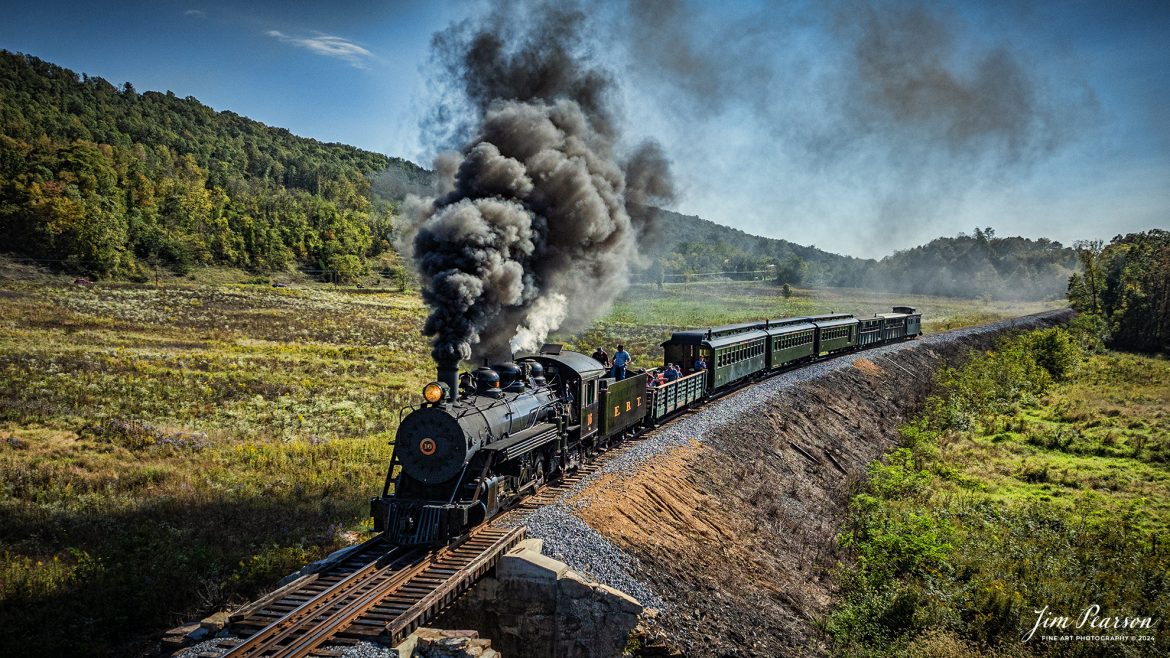 East Broad Top (EBT) steam locomotive #16 pulls a passenger train out of Rockhill Furnace, Pennsylvania on October 6th, 2024, on a beautiful fall afternoon.

According to the East Broad Top Website: Locomotive #16 was built in 1916 by the Baldwin Locomotive Works.

Entering the age of modern steam in 1916, the EBT received its first of three large Mikados. Unlike the previous three smaller locomotives, #16 came with superheaters, piston valves, and Southern valve gear. One story mentions #16 pulled 60 empty hoppers from Mt. Union to Rockhill in one train, literally clearing out the yard. #16 underwent an overhaul in 1955 and made only a handful of trips in early 1956 before the railroad shut down an overhaul when the EBT shut down. On February 1, 2023, the locomotive returned to service.

Tech Info: DJI Mavic 3 Classic Drone, RAW, 24mm, f/2.8, 1/4000, ISO 300.

#steamtrains #JimPearsonPhotography #trainsfromtheair #EastBroadTop