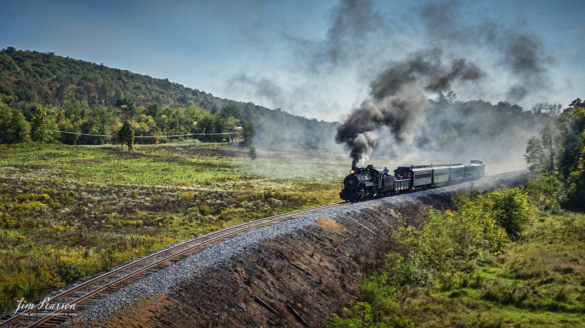 East Broad Top (EBT) steam locomotive #16 pulls a passenger train out of Rockhill Furnace, Pennsylvania on October 6th, 2024, on a beautiful fall afternoon.

According to the East Broad Top Website: Locomotive #16 was built in 1916 by the Baldwin Locomotive Works.

Entering the age of modern steam in 1916, the EBT received its first of three large Mikados. Unlike the previous three smaller locomotives, #16 came with superheaters, piston valves, and Southern valve gear. One story mentions #16 pulled 60 empty hoppers from Mt. Union to Rockhill in one train, literally clearing out the yard. #16 underwent an overhaul in 1955 and made only a handful of trips in early 1956 before the railroad shut down an overhaul when the EBT shut down. On February 1, 2023, the locomotive returned to service.

Tech Info: DJI Mavic 3 Classic Drone, RAW, 24mm, f/2.8, 1/4000, ISO 270.

#steamtrains #JimPearsonPhotography #trainsfromtheair #EastBroadTop