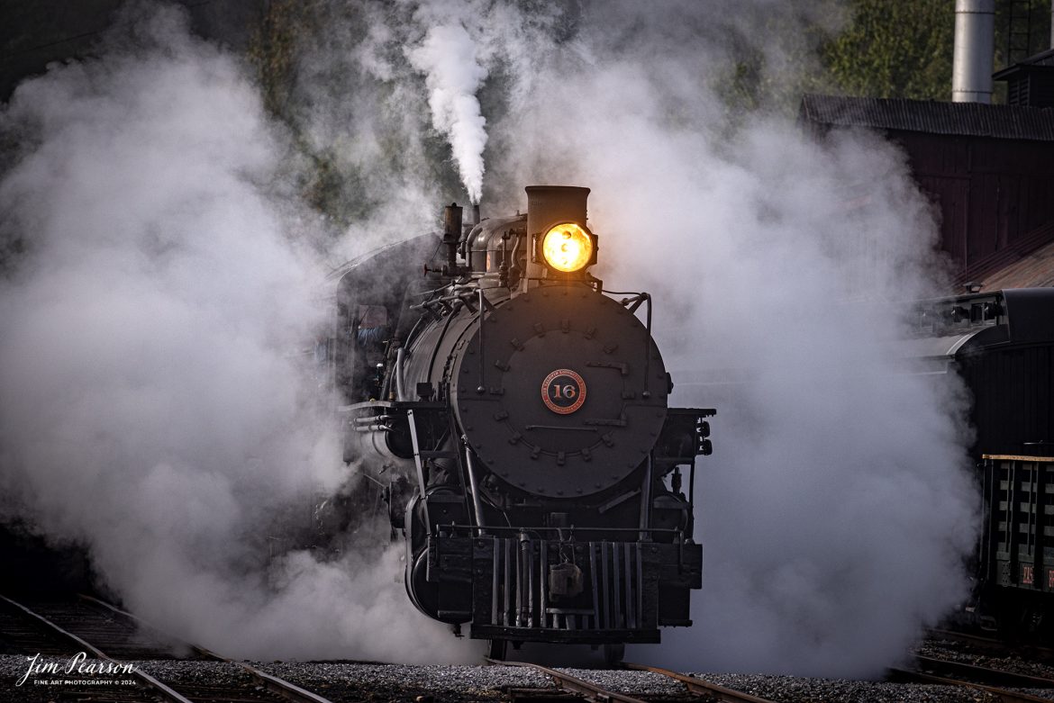 East Broad Top (EBT) steam locomotive 16 is surrounded by steam as it pulls a mixed freight out of the yard at Rockhill Furnace, Pennsylvania on October 6th, 2024, during the museum’s Friends of the East Broad top event.

According to the East Broad Top Website: Locomotive #16 was built in 1916 by the Baldwin Locomotive Works.

Entering the age of modern steam in 1916, the EBT received its first of three large Mikados. Unlike the previous three smaller locomotives, #16 came with superheaters, piston valves, and Southern valve gear. One story mentions #16 pulled 60 empty hoppers from Mt. Union to Rockhill in one train, literally clearing out the yard. #16 underwent an overhaul in 1955 and made only a handful of trips in early 1956 before the railroad shut down. On February 1, 2023, the locomotive returned to service.

Tech Info: Nikon D810, RAW, Nikon 70-300 @300mm, f/5.6, 1/640, ISO 220.

steam locomotive, train, railways, vintage, smoke, green hillside, sunlight, iron bridge, transportation, travel, photography of trains, train photography, Jim Pearson Photography, trending photo, East Broad Top Railroad, steam train