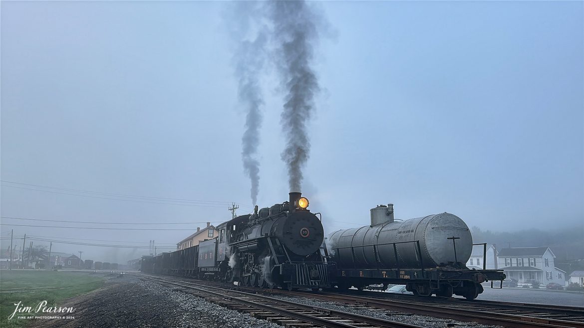 East Broad Top (EBT) steam locomotive #16 in the early morning fog with a mixed freight at Rockhill Furnace, Pennsylvania on October 6th, 2024, during the museum’s Friends of the East Broad top event.

According to the East Broad Top Website: Locomotive #16 was built in 1916 by the Baldwin Locomotive Works.

Entering the age of modern steam in 1916, the EBT received its first of three large Mikados. Unlike the previous three smaller locomotives, #16 came with superheaters, piston valves, and Southern valve gear. One story mentions #16 pulled 60 empty hoppers from Mt. Union to Rockhill in one train, literally clearing out the yard. #16 underwent an overhaul in 1955 and made only a handful of trips in early 1956 before the railroad shut down. On February 1, 2023, the locomotive returned to service.

Tech Info: iPhone 14 Pro, normal lens, f/1.8, 1/817th, ISO 80.

#photographyoftrains #trainphotography #JimPearsonPhotography #trendingphoto #eastbroadtoprailroad #steamtrains