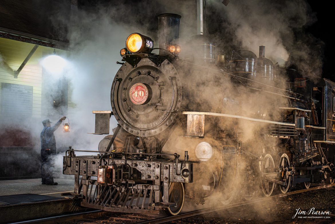 A brakeman holds up a lantern at the depot next to The Valley Railroad Company #40 during a night photo shoot at Essex, Connecticut, on October 8th, 2024, during a photo charter conducted by Dak Dillion Photography.

According to Wikipedia: The Valley Railroad, operating under the name Essex Steam Train and Riverboat, is a heritage railroad based in Connecticut on tracks of the Connecticut Valley Railroad, which was founded in 1868. The company began operations in 1971 between Deep River and Essex and has since reopened additional parts of the former Connecticut Valley Railroad line. It operates the Essex Steam Train and the Essex Clipper Dinner Train.

Tech Info: Nikon D810, RAW, Nikon 24-70 @ 52mm, 2.8, 1/100, ISO 7,200.

#photographyoftrains #bestsoldpicture #JimPearsonPhotography #thevalleyrailroad #steamtrains