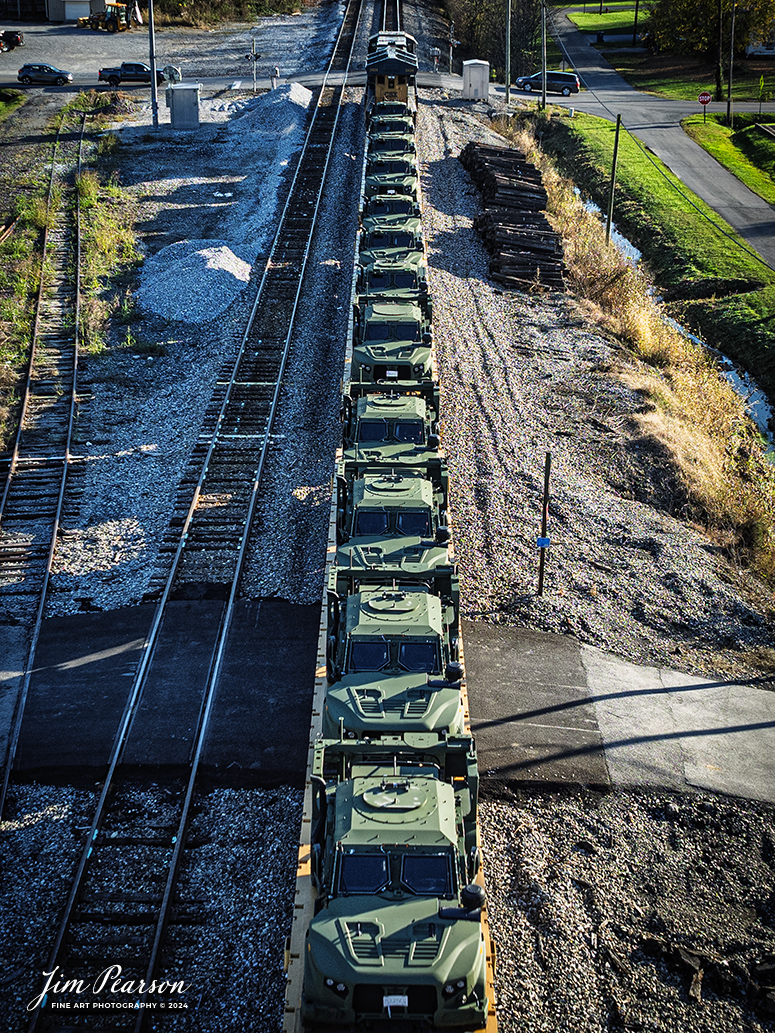 CSXT 3434 leads M647 with a very long string of military vehicles as they head south through downtown Hanson, Kentucky on November 12th, 2024, on the CSX Henderson Subdivision.

Tech Info: DJI Mavic 3 Classic Drone, RAW, 24mm, f/5, 1/500, ISO 100.

#besttrainphotograph #bestphoto #photographyoftrains #bestsoldpicture #JimPearsonPhotography