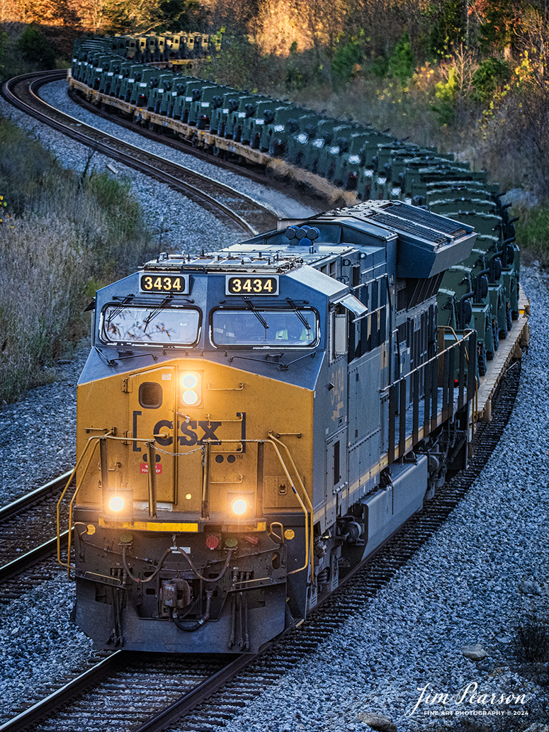 CSX M647 passes through the S curve at Nortonville, Kentucky on the CSX Henderson Subdivision, on November 13th, 2024, with a long string of military vehicles. 

Tech Info: Nikon D810, RAW, Nikon 70-300 @ 155mm f/5, 1/500, ISO 1800.

#besttrainphotograph #bestphoto #photographyoftrains #bestsoldpicture #JimPearsonPhotography #onecsx