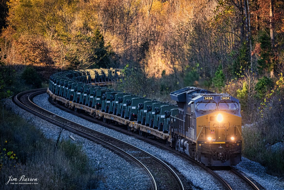 CSX M647 passes through the S curve at Nortonville, Kentucky on the CSX Henderson Subdivision, on November 13th, 2024, with a long string of military vehicles. 

Tech Info: Nikon D810, RAW, Nikon 70-300 @ 155mm f/5, 1/500, ISO 1800.

#besttrainphotograph #bestphoto #photographyoftrains #bestsoldpicture #JimPearsonPhotography #onecsx