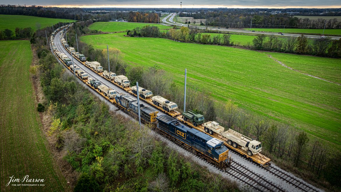 CSX S710 hooks up to their first string of military equipment on the Fort Campbell Wye from Fort Campbell, Kentucky, on the CSX Henderson Subdivision at Hopkinsville, Kentucky on November15th, 2024.

Tech Info: DJI Mavic 3 Classic Drone, RAW, 24mm, f/2.8, 1/120, ISO 180.

#militarytrain #besttrainphotograph #bestphoto #photographyoftrains #bestsoldpicture #JimPearsonPhotography