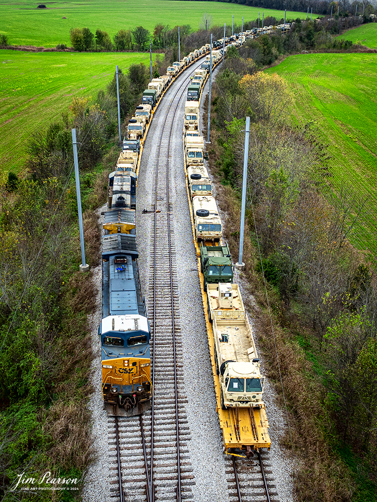 CSX S710 hooks up to their first string of military equipment on the Fort Campbell Wye from Fort Campbell, Kentucky, on the CSX Henderson Subdivision at Hopkinsville, Kentucky on November15th, 2024.

Tech Info: DJI Mavic 3 Classic Drone, RAW, 24mm, f/5, 1/50, ISO 100.

#militarytrain #besttrainphotograph #bestphoto #photographyoftrains #bestsoldpicture #JimPearsonPhotography