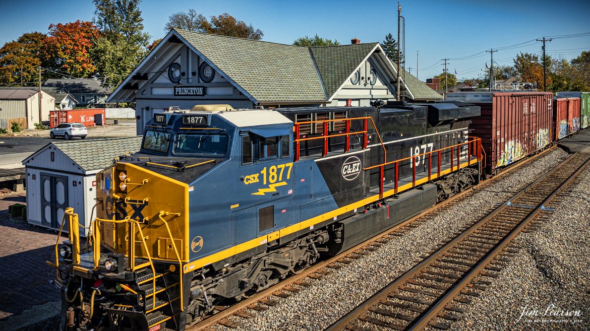 CSX M648 with the Chicago and Eastern Illinois Railroad (CE&I) heritage unit leading heads north past the old  C&EI and L&N Depot in Princeton, IN, on October 26th, 2024. 

According to the CSX Website: July 26, 2024 - CSX has unveiled its 17th heritage locomotive, paying tribute to the historic Chicago and Eastern Illinois Railroad. This locomotive is part of CSX's ongoing series celebrating the rich legacy of America's railroads.

The C&EI was established in 1877, initially serving as a regional line connecting Chicago with southern Illinois, St. Louis, Mo. and Evansville, Ind. Over time, it expanded its reach, becoming an important link between the Midwest and the southern United States. The C&EI played a vital role in transporting coal, agricultural products, and manufactured goods, significantly contributing to the region's economic development.

In 1967, the C&EI was absorbed by the Missouri Pacific Railroad and the Louisville and Nashville Railroad. In the 1980s, as CSX expanded its network, it acquired various lines and assets from other railroads, including parts of former C&EI lines that had been integrated into the Missouri Pacific. This indirect acquisition process allowed CSX to incorporate the historic routes and legacy of the C&EI into its expansive system.

Tech Info: DJI Mavic 3 Classic Drone, RAW, 24mm, f/2.8, 1/2500, ISO 120.

#picturesofrailways #besttrainphotograph #bestphoto #photographyoftrains #bestsoldpicture #JimPearsonPhotography