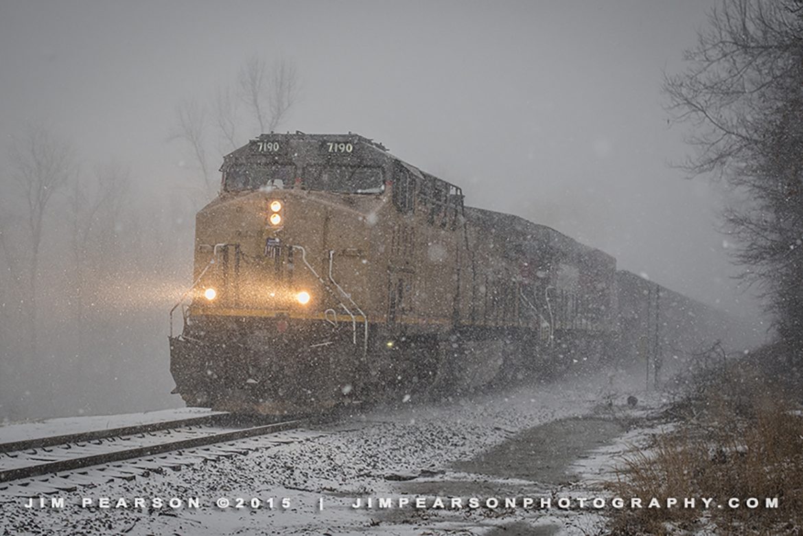 March 4, 2015 – A Paducah and Louisville Railroad crew moves a empty coal train north through the driving snow at Richland, Ky with Union Pacific 7190 and Ferromex 4664 trailing. This was the start of the 16-19 inches of snow that fell on the area overnight back in 2015.

Tech Info: Nikon D800, RAW, Nikon 24-70 @ 50mm, f/3.5, 1/1000, ISO 1,250.

#photographyoftrains #trainphotography #JimPearsonPhotography #trendingphoto