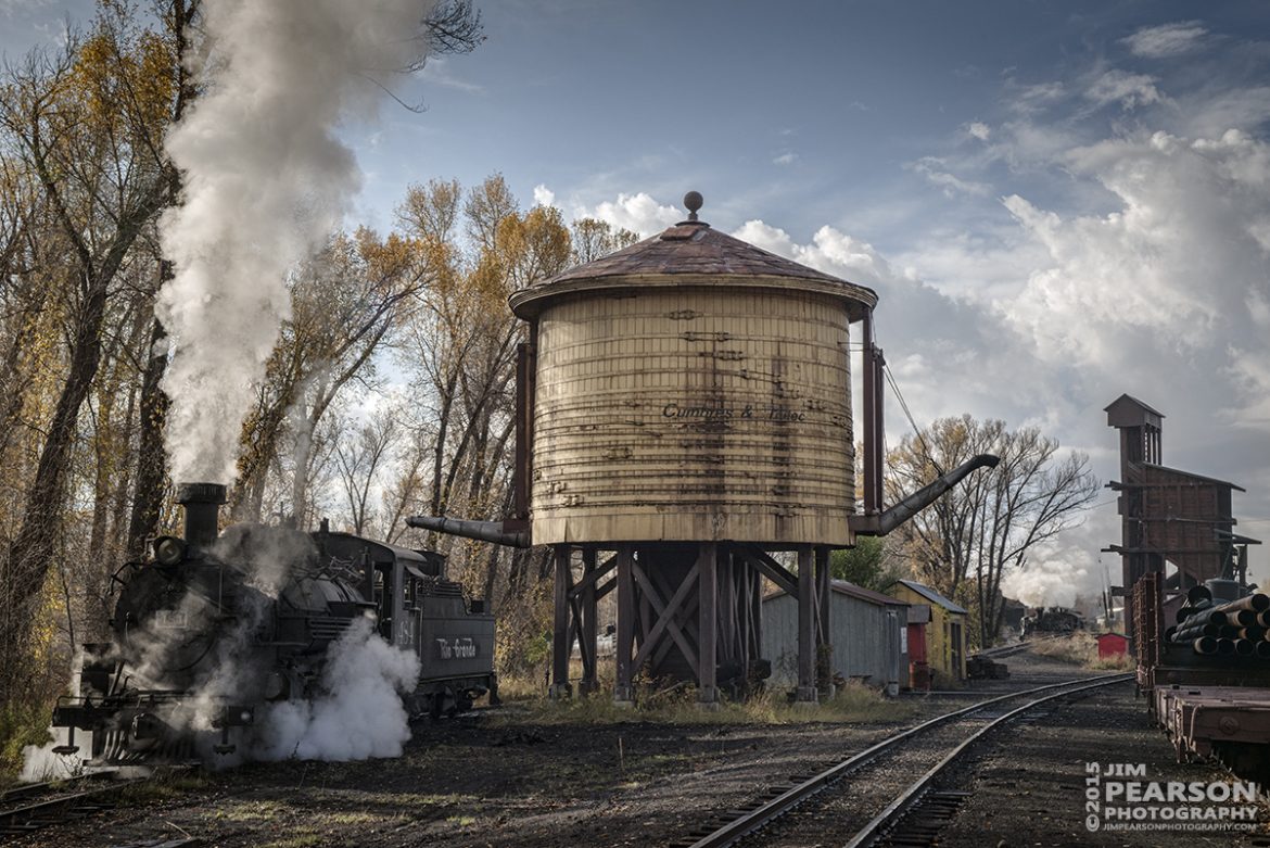 October 20, 2015 - Cumbres & Toltec Scenic Railroad's 484, a K-36 class 2-8-2 engine, takes on water in the yards at Chama, New Mexico as engine 489 drops ashes in the background. 

Tech Info: 1/640 | f/11 | ISO 560 | Lens: Sigma 24-70 @ 56mm with a Nikon D800 shot and processed in RAW.

#photographyoftrains #trainphotography #JimPearsonPhotography #trendingphoto #CumbresandToltecScenicRailroad