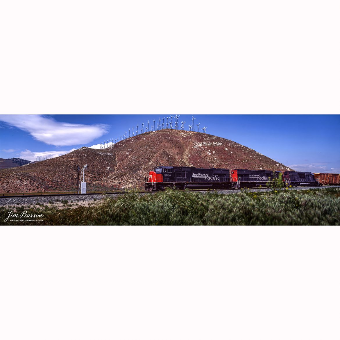 Film Wednesday – Southern Pacific 9804 leads a mixed freight through the Tehachapi mountains with windmills on the hill in the distance as they head toward Bakersfield, California I believe, in this film scan from a 6x17cm slide that was probably shot sometime in the early 1990’s. 

According to Wikipedia: The Southern Pacific (reporting mark SP) (or Espee from the railroad initials) was an American Class I railroad network that existed from 1865 to 1996 and operated largely in the Western United States. The system was operated by various companies under the names Southern Pacific Railroad, Southern Pacific Company and Southern Pacific Transportation Company.

The original Southern Pacific began in 1865 as a land holding company. The last incarnation of the Southern Pacific, the Southern Pacific Transportation Company, was founded in 1969 and assumed control of the Southern Pacific system. The Southern Pacific Transportation Company was acquired in 1996 by the Union Pacific Corporation and merged with their Union Pacific Railroad.

Tech Info: Camera, Fuji 6x17, Kodachrome Slide Film, no other data recorded, Scanned with an Epson Perfection V700 PHOTO scanner.

#slidescan #filmphotography #trains #railroads #jimpearsonphotography