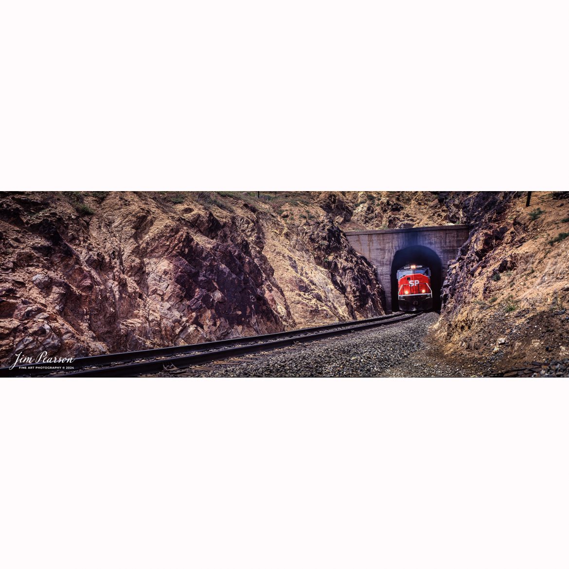 Film Wednesday – Southern Pacific 9822 leads a mixed freight as it exits one of the many tunnels through the Tehachapi mountains in California, in this film scan from a 6x17cm slide that was probably shot sometime in the early 1990’s. 

According to Wikipedia: The Southern Pacific (reporting mark SP) (or Espee from the railroad initials) was an American Class I railroad network that existed from 1865 to 1996 and operated largely in the Western United States. The system was operated by various companies under the names Southern Pacific Railroad, Southern Pacific Company and Southern Pacific Transportation Company.

The original Southern Pacific began in 1865 as a land holding company. The last incarnation of the Southern Pacific, the Southern Pacific Transportation Company, was founded in 1969 and assumed control of the Southern Pacific system. The Southern Pacific Transportation Company was acquired in 1996 by the Union Pacific Corporation and merged with their Union Pacific Railroad.

Tech Info: Camera, Fuji 6x17, Kodachrome Slide Film, no other data recorded, Scanned with an Epson Perfection V700 PHOTO scanner.

#slidescan #filmphotography #trains #railroads #jimpearsonphotography