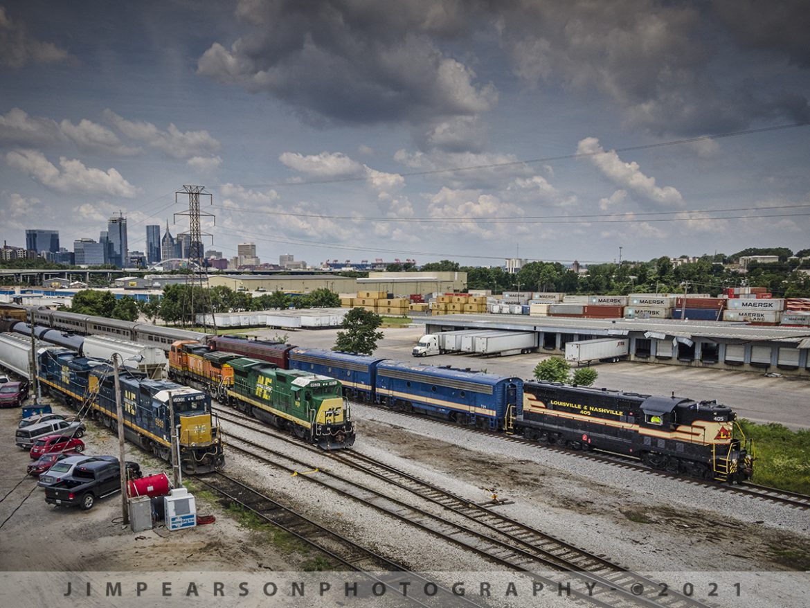 Tennessee Moonshine Sippin Excursion Train Departs Nashville, TN

The Tennessee Moonshine Sippin Excursion Train departs from the Tennessee Central Railway Museum (TCRX), which operates out of Nashville, TN, on June 12th, 2021 with downtown Nashville in the distance. Here we find L&N 405 leading the train as it passes the Nashville & Eastern Railroad where myself and fellow railfan Ryan Scott, of Steelrails, caught our first shots while chasing this train from Nashville to Watertown, TN and back, along the Nashville, and Eastern Railway line. 

Once restoration is complete Nashville Steams Nashville, Chattanooga & St. Louis Railway steam locomotive No. 576 will lead trains along this same route! The rest of the power in the consist was L&N F7B 715 & 719, plus TCRX E8A 6902 trailing which led on the return trip.

According to their website: The Tennessee Central Railway Museum is a volunteer, non-profit organization. Our mission is to preserve, restore, interpret, and operate historic railroad equipment to educate our guests about America's railroads.

Since 1989, TCRM has been running passenger excursions from Nashville to points east such as Lebanon, Watertown, Baxter, Cookeville, and Monterey, Tennessee. 

#trainphotography #railroadphotography #trains #railways #dronephotography #jimpearsonphotography 

Tech Info: DJI Mavic Air 2 Drone, RAW, 4.5mm (24mm equivalent lens) f/2.8, 1/800, ISO 100.