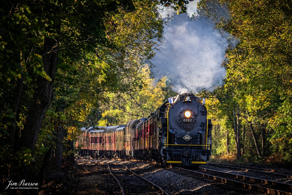 Reading Blue Mountain & Northern Railroad steam locomotive 2102 pulls through the countryside on October 5th, 2024, during its first day of the year of pulling Fall Foliage Excursions, as it heads for Jim Thorpe, Pennsylvania.

According to their website: The Reading Company T-1 class #2102 was built in the Reading’s own locomotive shops in 1945. With drivers of 70” diameter, it weighs 404 tons, and its tender holds up to 26 tons of coal, and up to 19,000 gallons of water. After the Reading Steam era was over, the Reading Company used 2102 for the Reading Rambles on several different excursions. The 2102 has had many different owners since it was retired by the Reading Railroad. It is one of only four to survive. The other remaining locomotives are the 2100, 2101, and 2124.

The Blue Mountain and Reading Railroad purchased the 2102 in 1987, and it ran on the Temple to South Hamburg line into the early 1990’s. Once the Blue Mountain and Reading Railroad became the Reading Blue Mountain & Northern, the 2102 ran over Reading & Northern’s rails for a short time before it was removed from service in the early 1990’s. 

In 2022, steam locomotive 2102 reentered service on the Reading & Northern. The locomotive has been used actively to pull both passenger excursions and revenue freight trains.

Tech Info: Nikon D810, RAW, Nikon 70-300 @ 300mm,  1/640, f/5.6, ISO 900.

#steamtrains #besttrainphotograph #JimPearsonPhotography #RBNRR