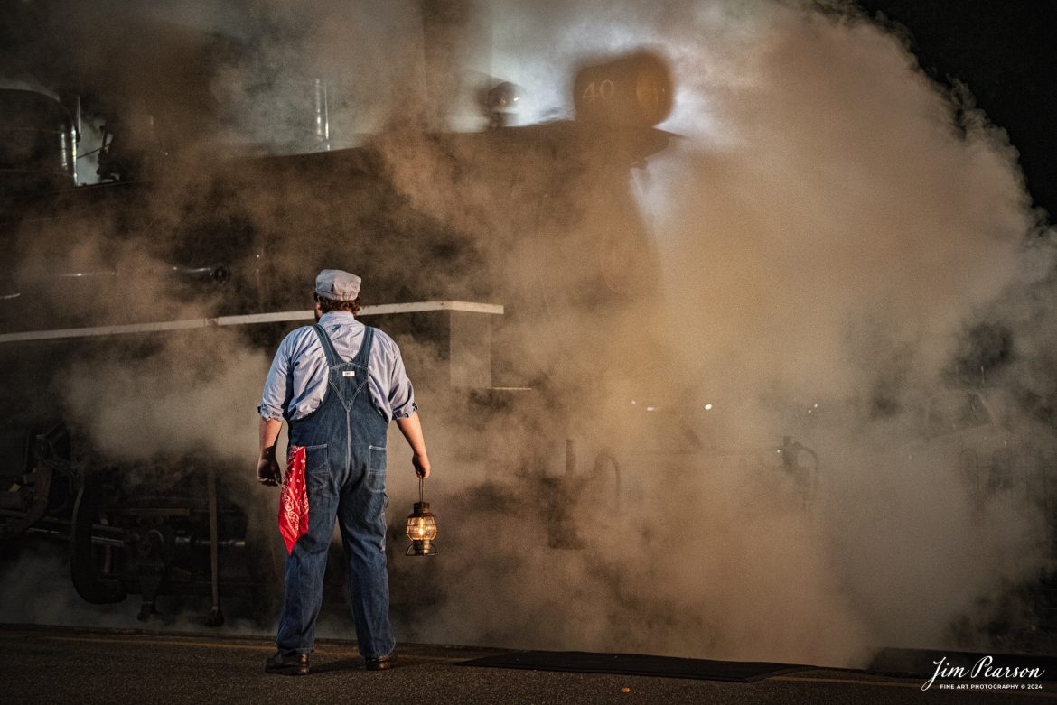 A brakeman holds up a lantern at the depot next to The Valley Railroad Company #40 during a night photo shoot at Essex, Connecticut, on October 8th, 2024, during a photo charter conducted by Dak Dillion Photography.

According to Wikipedia: The Valley Railroad, operating under the name Essex Steam Train and Riverboat, is a heritage railroad based in Connecticut on tracks of the Connecticut Valley Railroad, which was founded in 1868. The company began operations in 1971 between Deep River and Essex and has since reopened additional parts of the former Connecticut Valley Railroad line. It operates the Essex Steam Train and the Essex Clipper Dinner Train.

Tech Info: Nikon D810, RAW, Nikon 24-70 @ 52mm, 2.8, 1/100, ISO 6,400.

#photographyoftrains #bestsoldpicture #JimPearsonPhotography #thevalleyrailroad #steamtrains