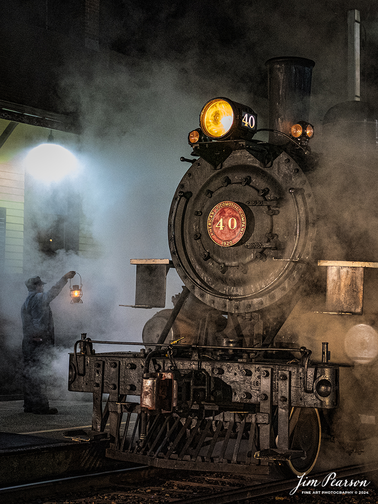 A brakeman holds up a lantern at the depot next to The Valley Railroad Company #40 during a night photo shoot at Essex, Connecticut, on October 8th, 2024, during a photo charter conducted by Dak Dillion Photography.

According to Wikipedia: The Valley Railroad, operating under the name Essex Steam Train and Riverboat, is a heritage railroad based in Connecticut on tracks of the Connecticut Valley Railroad, which was founded in 1868. The company began operations in 1971 between Deep River and Essex and has since reopened additional parts of the former Connecticut Valley Railroad line. It operates the Essex Steam Train and the Essex Clipper Dinner Train.

Tech Info: Nikon D810, RAW, Nikon 24-70 @ 52mm, 2.8, 1/100, ISO 7,200.

#photographyoftrains #bestsoldpicture #JimPearsonPhotography #thevalleyrailroad #steamtrains