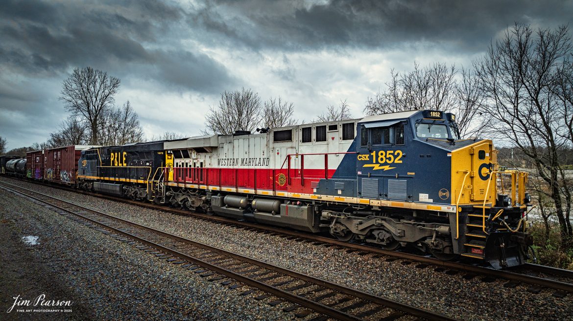 This is my first catch where there were two CSX Heritage Units leading a train! I got word about this move on CSX M648 the day before and when it finally arrived where I setup to catch it the first time at Mortons Gap, Ky the wind and rain was bad, but I did get a short video clip here is in my December 21st, 2024, Saturday Edited Video.

In this shot the Western Maryland and P&LE Heritage units lead M648 lays off crossings between Sebree and Robards, Kentucky, waiting to meet G387, on the CSX Henderson Subdivision on December 16th 2024.

According to the CSX Website: The Western Maryland Railroad operated between 1852 and 1983 in Maryland, West Virginia, and Pennsylvania. It was a small railroad that primarily transported coal and freight.

“In 1983 the Western Maryland fully merged with the B&O (Baltimore and Ohio Railroad), which merged with the C&O (Chesapeake and Ohio Railroad) in 1987. They eventually merged with the Seaboard System to form CSX.” explained Tim Music, a CSX carman painter who assisted with the project.

The Pittsburgh & Lake Erie Railroad was established in 1875 with a primary mission of transporting essential industrial materials such as coal, coke, iron ore, limestone, and steel among the bustling industrial hubs of the region.

“It’s mainline connected Pittsburgh, Pennsylvania with Youngstown, Ohio and Connellsville, Pennsylvania. It did not actually reach Lake Erie until 1976,” explained Tim Music, a carman painter at the CSX Waycross Locomotive Shop where the unit was produced.

Despite its relatively modest route mileage, the P&LE Railroad earned the nickname “Little Giant” due to the enormous volume of heavy tonnage it moved. This impressive capability drew significant attention and by 1887, the P&LE became a subsidiary of the dominant New York Central Railroad. Under this new ownership, the P&LE enjoyed substantial improvements to its tracks and added capacity for passenger services, further enhancing its regional significance.

Tech Info: DJI Mavic 3 Classic Drone, RAW, 24mm, f/2.8, 1/320, ISO 150.

#railroad #railroads #train, #trains #railway #railway #railtransport #railroadengines #picturesoftrains #picturesofrailways #besttrainphotograph #bestphoto #photographyoftrains #bestsoldpicture #JimPearsonPhotography #trainsfromadrone #csxheritagelocomotives