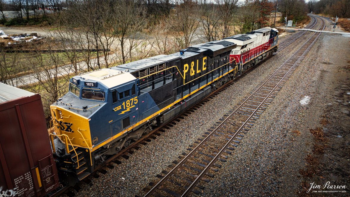 This is my first catch where there were two CSX Heritage Units leading a train! I got word about this move on CSX M648 the day before and when it finally arrived where I setup to catch it the first time at Mortons Gap, Ky the wind and rain was bad, but I did get a short video clip here is in my December 21st, 2024, Saturday Edited Video.

In this shot the Western Maryland and P&LE Heritage units lead M648 lays off crossings between Sebree and Robards, Kentucky, waiting to meet G387, on the CSX Henderson Subdivision on December 16th 2024.

According to the CSX Website: The Western Maryland Railroad operated between 1852 and 1983 in Maryland, West Virginia, and Pennsylvania. It was a small railroad that primarily transported coal and freight.

“In 1983 the Western Maryland fully merged with the B&O (Baltimore and Ohio Railroad), which merged with the C&O (Chesapeake and Ohio Railroad) in 1987. They eventually merged with the Seaboard System to form CSX.” explained Tim Music, a CSX carman painter who assisted with the project.

The Pittsburgh & Lake Erie Railroad was established in 1875 with a primary mission of transporting essential industrial materials such as coal, coke, iron ore, limestone, and steel among the bustling industrial hubs of the region.

“It’s mainline connected Pittsburgh, Pennsylvania with Youngstown, Ohio and Connellsville, Pennsylvania. It did not actually reach Lake Erie until 1976,” explained Tim Music, a carman painter at the CSX Waycross Locomotive Shop where the unit was produced.

Despite its relatively modest route mileage, the P&LE Railroad earned the nickname “Little Giant” due to the enormous volume of heavy tonnage it moved. This impressive capability drew significant attention and by 1887, the P&LE became a subsidiary of the dominant New York Central Railroad. Under this new ownership, the P&LE enjoyed substantial improvements to its tracks and added capacity for passenger services, further enhancing its regional significance.

Tech Info: DJI Mavic 3 Classic Drone, RAW, 24mm, f/2.8, 1/60, ISO 100.

#railroad #railroads #train, #trains #railway #railway #railtransport #railroadengines #picturesoftrains #picturesofrailways #besttrainphotograph #bestphoto #photographyoftrains #bestsoldpicture #JimPearsonPhotography #trainsfromadrone #csxheritagelocomotives