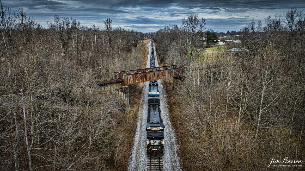 Norfolk Southern 4261 Leads CSX B647, a loaded ethanol train, south as it passes under the Paducah and Louisville Railway line at the location known as Monarch, at Madisonville, Ky on December 26th, 2024, on the CSX Henderson Subdivision. This train runs between Bensenville, IL (CPKC) and TDSI (RPMG) - Lawrenceville, GA, on a as needed basis.

Tech Info: DJI Mavic 3 Classic Drone, RAW, 24mm, f/2.8, 1/1000, ISO 140.

#railroad #railroads #train, #trains #railway #railway #steamtrains #railtransport #railroadengines #picturesoftrains #picturesofrailways #besttrainphotograph #bestphoto #photographyoftrains #bestsoldpicture #JimPearsonPhotography #trainsfromtheair #trainsfromadrone #norfolksouthern