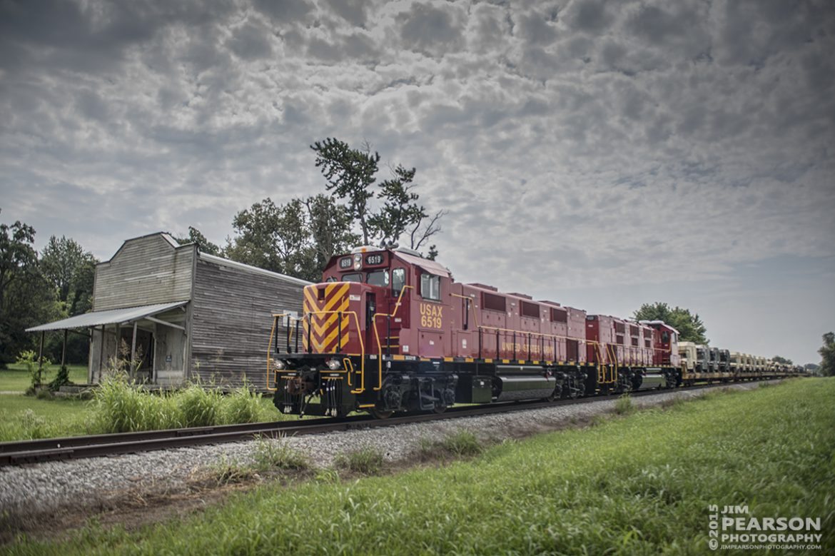 July 27, 2015 - United States Army GenSets 6519 and 6520 passes an old general store along highway 41A, as they move a loaded military train from Ft. Campbell Army Post to CSX's Fort Campbell Wye in Hopkinsville, Ky. There CSX picked up the train and took it on north on the Henderson Subdivision. 

Tech Info: 1/2000sec, f/4.5, ISO 125, Lens: Sigma 24-70  @ 24mm with a Nikon D800 shot and processed in RAW.

#photographyoftrains #trainphotography #JimPearsonPhotography #trendingphoto #militarytrains