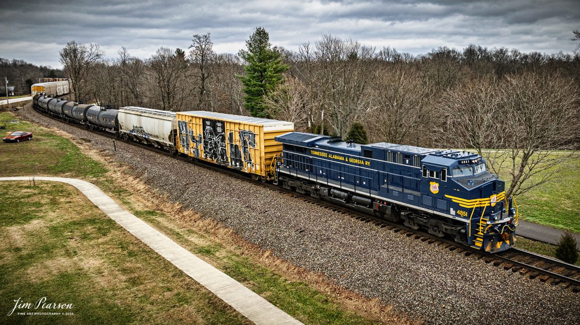 I spent New Year’s Day with fellow railfan Ryan Scott and we spent it chasing Norfolk Southern’s newest Heritage Unit, Tennessee, Alabama & Georgia Railway locomotive 4851 as it ran as the DPU on NS 167 On January 1st, 2025.Here the engine brings up the rear as the DPU on NS 167 as it heads east out of Birdseye, Indiana.

Norfolk Southern recently unveiled their newest addition to their Heritage Fleet: the Tennessee, Alabama & Georgia Railway locomotive!

“Once a vital link between Chattanooga and Gadsden, the TAG Railway played a key role in moving coal, steel, and more. Its legacy is now proudly reflected in our fleet.”

Tech Info: DJI Mavic 3 Classic Drone, RAW, 24mm, f/2.8, 1/320, ISO 170.

#railroad #railroads #train, #trains #railway #railway #railtransport #railroadengines #picturesoftrains #picturesofrailways #besttrainphotograph #bestphoto #photographyoftrains #bestsoldpicture #JimPearsonPhotography #trainsfromadrone #nsheritagelocomotives #NSTAGlocomotive