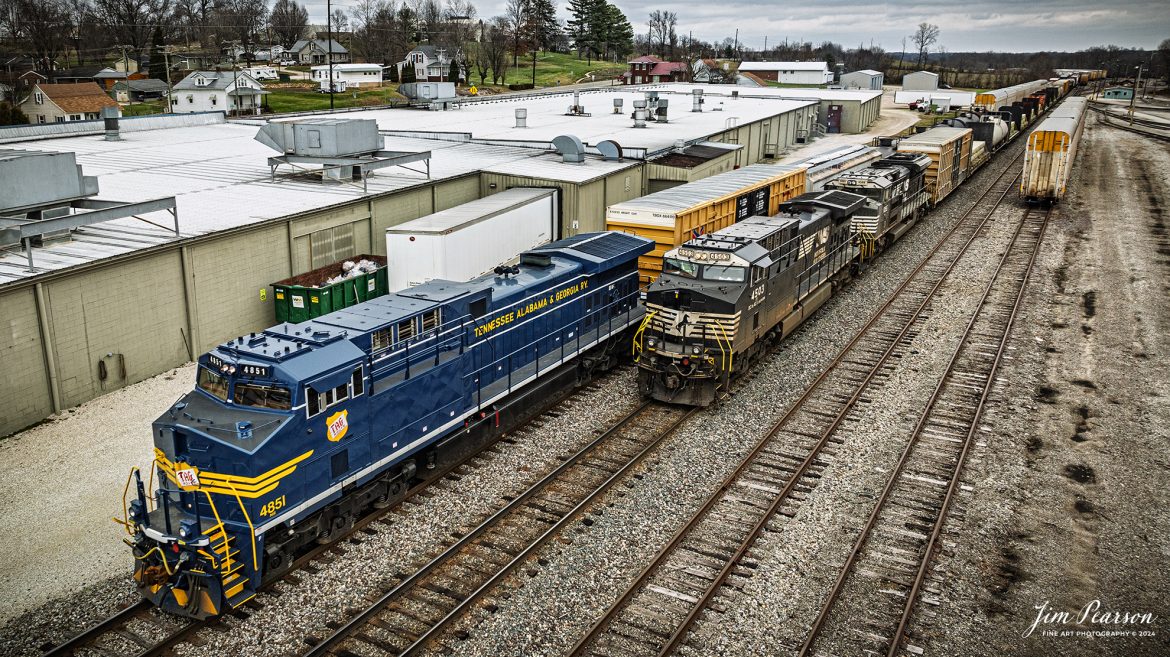 I spent New Year’s Day with fellow railfan Ryan Scott and we spent it chasing Norfolk Southern’s newest Heritage Unit, Tennessee, Alabama & Georgia Railway locomotive 4851 as it ran as the DPU on NS 167 On January 1st, 2025. Here the TAG locomotive passes the head end of their counterpart train, NS 168 as they meet at Huntingburg, IN.

Norfolk Southern recently unveiled their newest addition to their Heritage Fleet: the Tennessee, Alabama & Georgia Railway locomotive!

“Once a vital link between Chattanooga and Gadsden, the TAG Railway played a key role in moving coal, steel, and more. Its legacy is now proudly reflected in our fleet.”

Tech Info: DJI Mavic 3 Classic Drone, RAW, 24mm, f/2.8, 1/320, ISO 130.

#railroad #railroads #train, #trains #railway #railway #railtransport #railroadengines #picturesoftrains #picturesofrailways #besttrainphotograph #bestphoto #photographyoftrains #bestsoldpicture #JimPearsonPhotography #trainsfromadrone #nsheritagelocomotives #NSTAGlocomotive