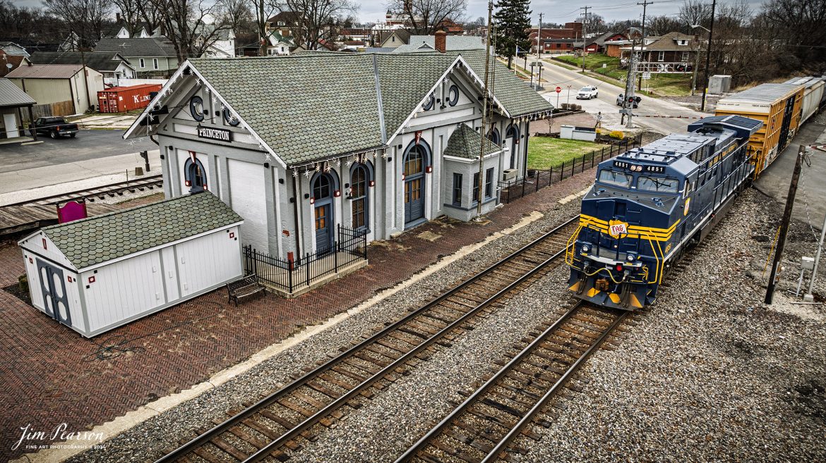 I spent New Year’s Day with fellow railfan Ryan Scott and we spent it chasing Norfolk Southern’s newest Heritage Unit, Tennessee, Alabama & Georgia Railway locomotive 4851 as it ran as the DPU on NS 167 On January 1st, 2025. Here the TAG locomotive passes the old CE&I depot in downtown Princeton, Indiana on their move east.

Norfolk Southern recently unveiled their newest addition to their Heritage Fleet: the Tennessee, Alabama & Georgia Railway locomotive!

“Once a vital link between Chattanooga and Gadsden, the TAG Railway played a key role in moving coal, steel, and more. Its legacy is now proudly reflected in our fleet.”

Tech Info: DJI Mavic 3 Classic Drone, RAW, 24mm, f/2.8, 1/240, ISO 100.

#railroad #railroads #train, #trains #railway #railway #railtransport #railroadengines #picturesoftrains #picturesofrailways #besttrainphotograph #bestphoto #photographyoftrains #bestsoldpicture #JimPearsonPhotography #trainsfromadrone #nsheritagelocomotives #NSTAGlocomotive