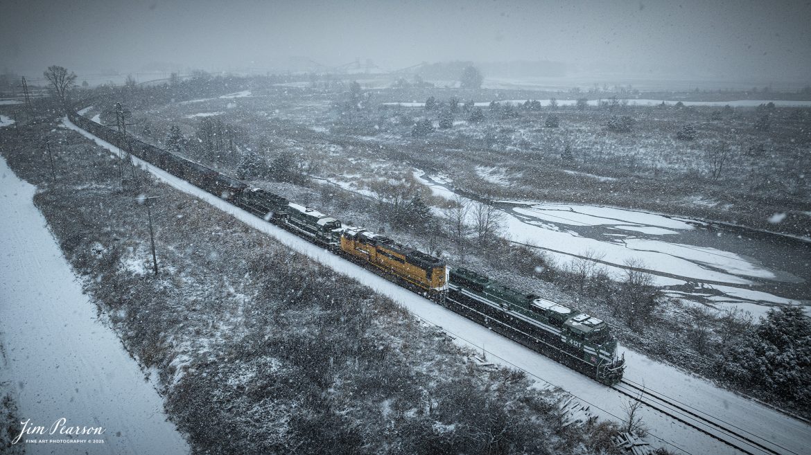 Paducah and Louisville Railway 4121 heads up a coal train as they load the tail end of their train at the Warrior Coal Loop outside of Nebo, Kentucky on January 10th, 2024, during a heavy snowfall.

Tech Info: DJI Mavic 3 Classic Drone, RAW, 22mm, f/2.8, 1/1000, ISO 100.

#trainphotography #railroadphotography #trains #railways #trainphotographer #railroadphotographer #jimpearsonphotography #PaducahandLouisvilleRailway #trainsinthesnow