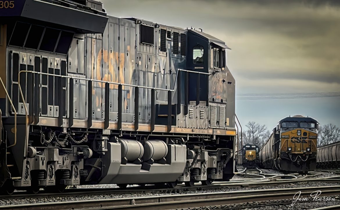 A loaded CSX grain train pulls into the yard from the north end of Howell Yard at Evansville, Indiana, as another train works in the yard in the distance on February 4th, 2023. 

The yard is located at milepost 323 and was constructed in 1899 by the Louisville and Nashville Railroad and it brought substantial growth to the Evansville area, and you can find more information, photos and drawings at https://southernillinoisrailroads.com/lnndepots/howell-indiana-l-and-n-railroad-railroad-yard.html

Tech Info: iPhone 14 Pro, JPG, f/2.8, 1/582, ISO 32.

#trainphotography #railroadphotography #trains #railways #jimpearsonphotography #trainphotographer #railroadphotographer #iPhone4Pro #csx