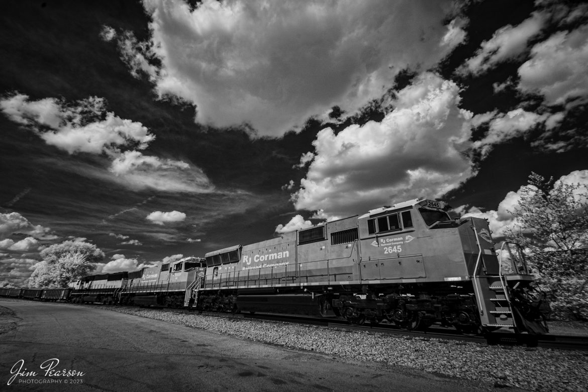 This weeks Saturday Infrared photo is of newly painted and refurbished RJ Corman units 2645 and 2648, along with GMTX 9059, as they sit at Nugent Sand Yard in Louisville, Ky on Saturday afternoon, April 15th, 2023. These first two units were recently acquired by the company from Norfolk Southern and are SD70M locomotives, which are beginning to see road service after coming out of the shops.

Tech Info: Fuji XT-1, RAW, Converted to 720nm B&W IR, Nikon 10-24 @10mm, f/9, 1/250, ISO 400.

#trainphotography #railroadphotography #trains #railways #jimpearsonphotography #infraredtrainphotography #infraredphotography #trainphotographer #railroadphotographer #RJCrailroad #RJCorman #LouisvilleKy