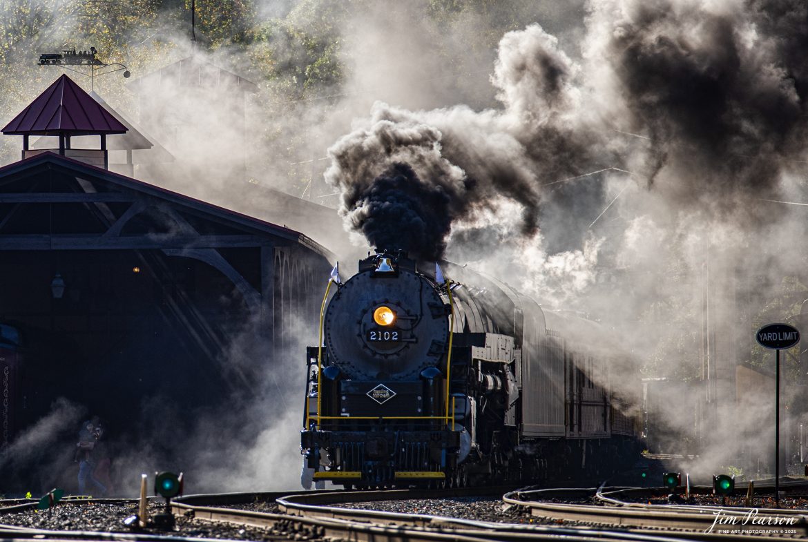 Reading Blue Mountain & Northern Railroad steam locomotive 2102 departs the station at Port Clinton, Pennsylvania on October 5th, 2024,during its first day of the year of pulling Fall Foliage Excursions.

According to their website: The Reading Company T-1 class #2102 was built in the Reading’s own locomotive shops in 1945. With drivers of 70” diameter, it weighs 404 tons, and its tender holds up to 26 tons of coal, and up to 19,000 gallons of water. After the Reading Steam era was over, the Reading Company used 2102 for the Reading Rambles on several different excursions. The 2102 has had many different owners since it was retired by the Reading Railroad. It is one of only four to survive. The other remaining locomotives are the 2100, 2101, and 2124.

The Blue Mountain and Reading Railroad purchased the 2102 in 1987, and it ran on the Temple to South Hamburg line into the early 1990’s. Once the Blue Mountain and Reading Railroad became the Reading Blue Mountain & Northern, the 2102 ran over Reading & Northern’s rails for a short time before it was removed from service in the early 1990’s. 

In 2022, steam locomotive 2102 reentered service on the Reading & Northern. The locomotive has been used actively to pull both passenger excursions and revenue freight trains.

Tech Info: Nikon D810, RAW, Nikon 70-300 @ 220mm, f/5.6, 1640, ISO 220.

#steamtrains #besttrainphotograph #JimPearsonPhotography #RBNRR